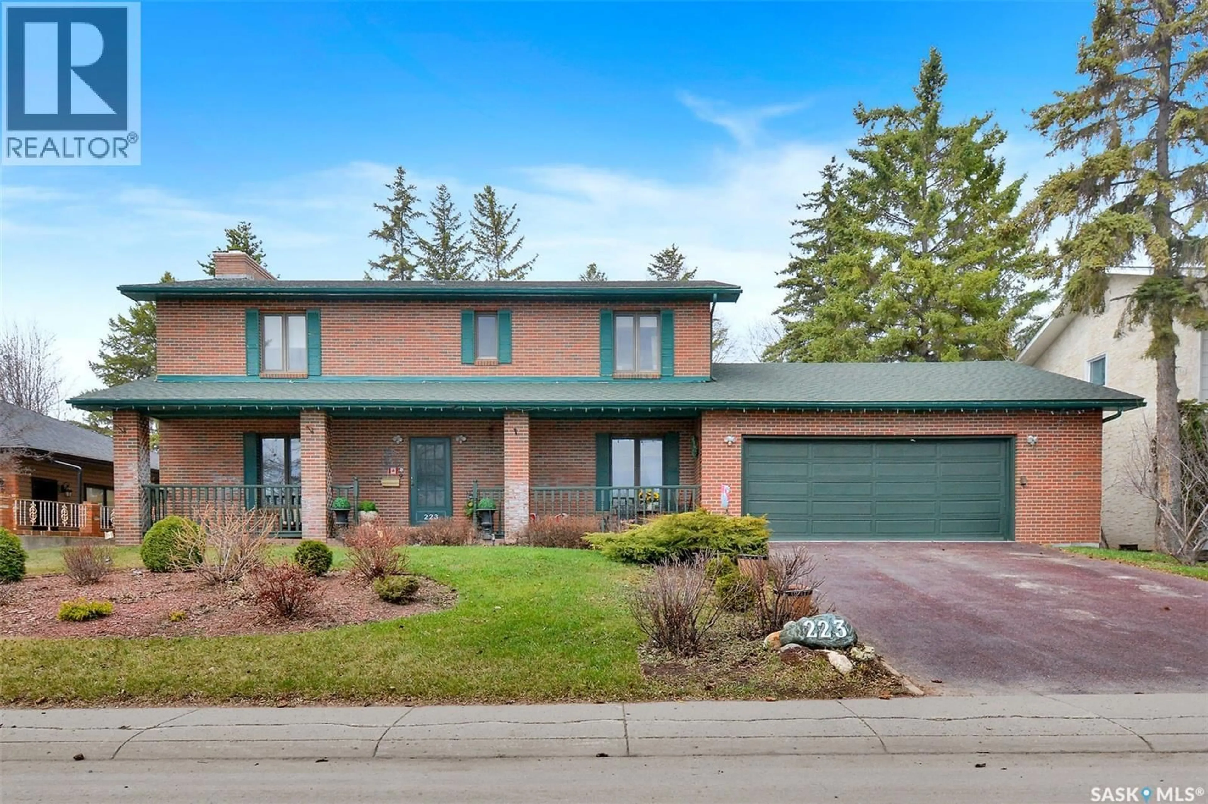 Home with brick exterior material, street for 223 WHITESWAN DRIVE, Saskatoon Saskatchewan S7K4M6