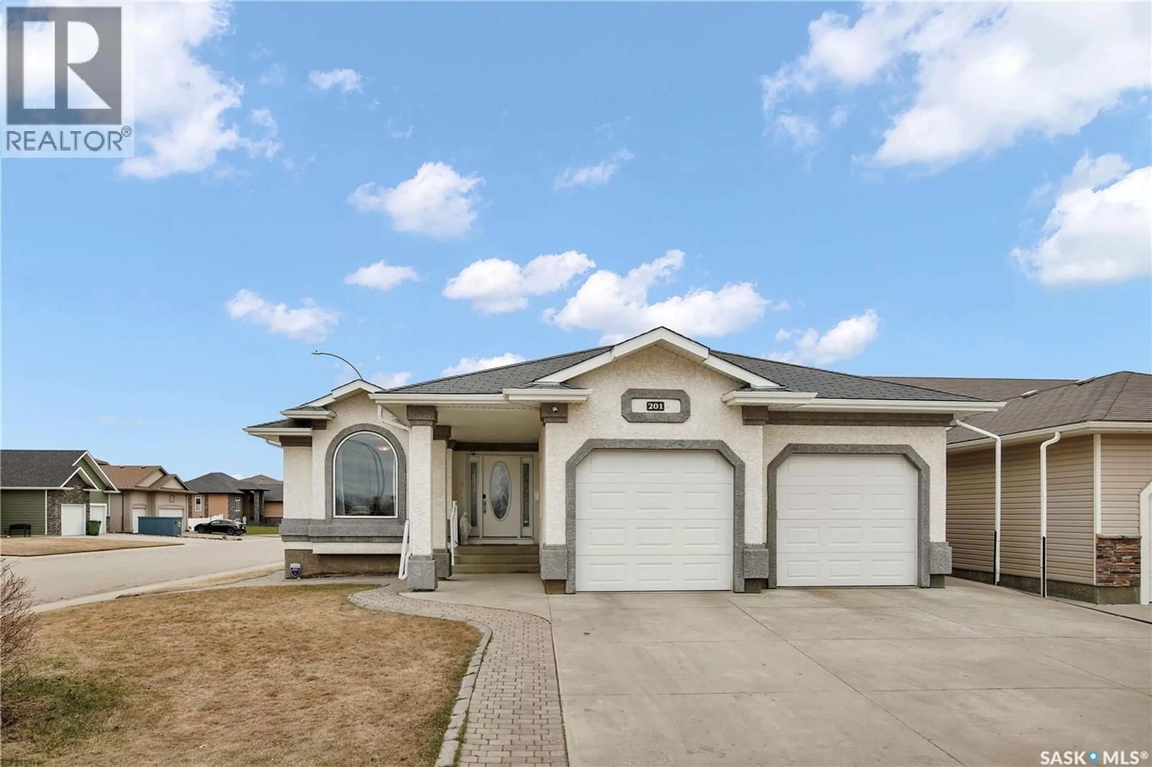 Home with vinyl exterior material, street for 201 BROOKSIDE COURT, Warman Saskatchewan S0K0A1