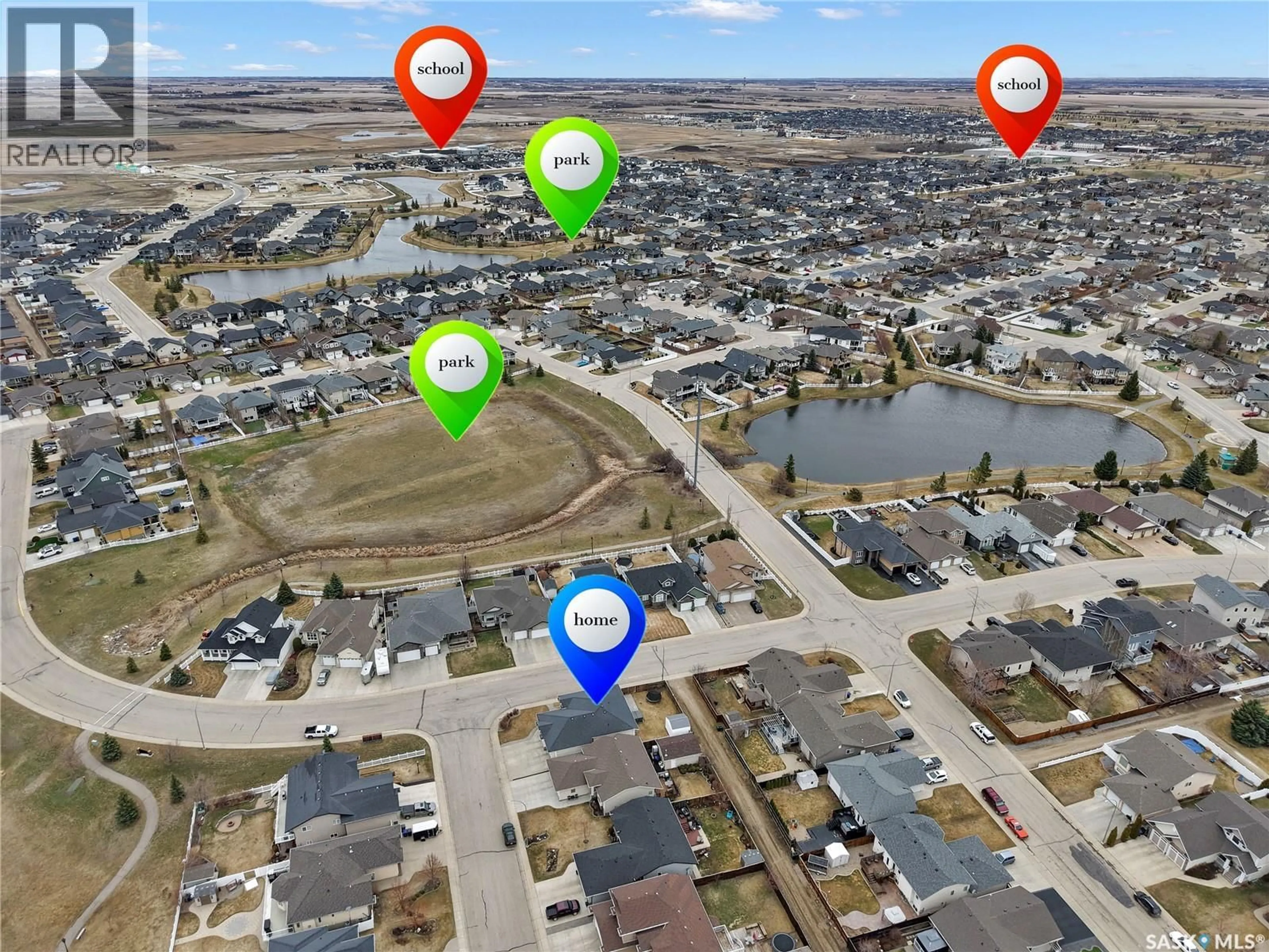 A pic from outside/outdoor area/front of a property/back of a property/a pic from drone, water/lake/river/ocean view for 201 BROOKSIDE COURT, Warman Saskatchewan S0K0A1