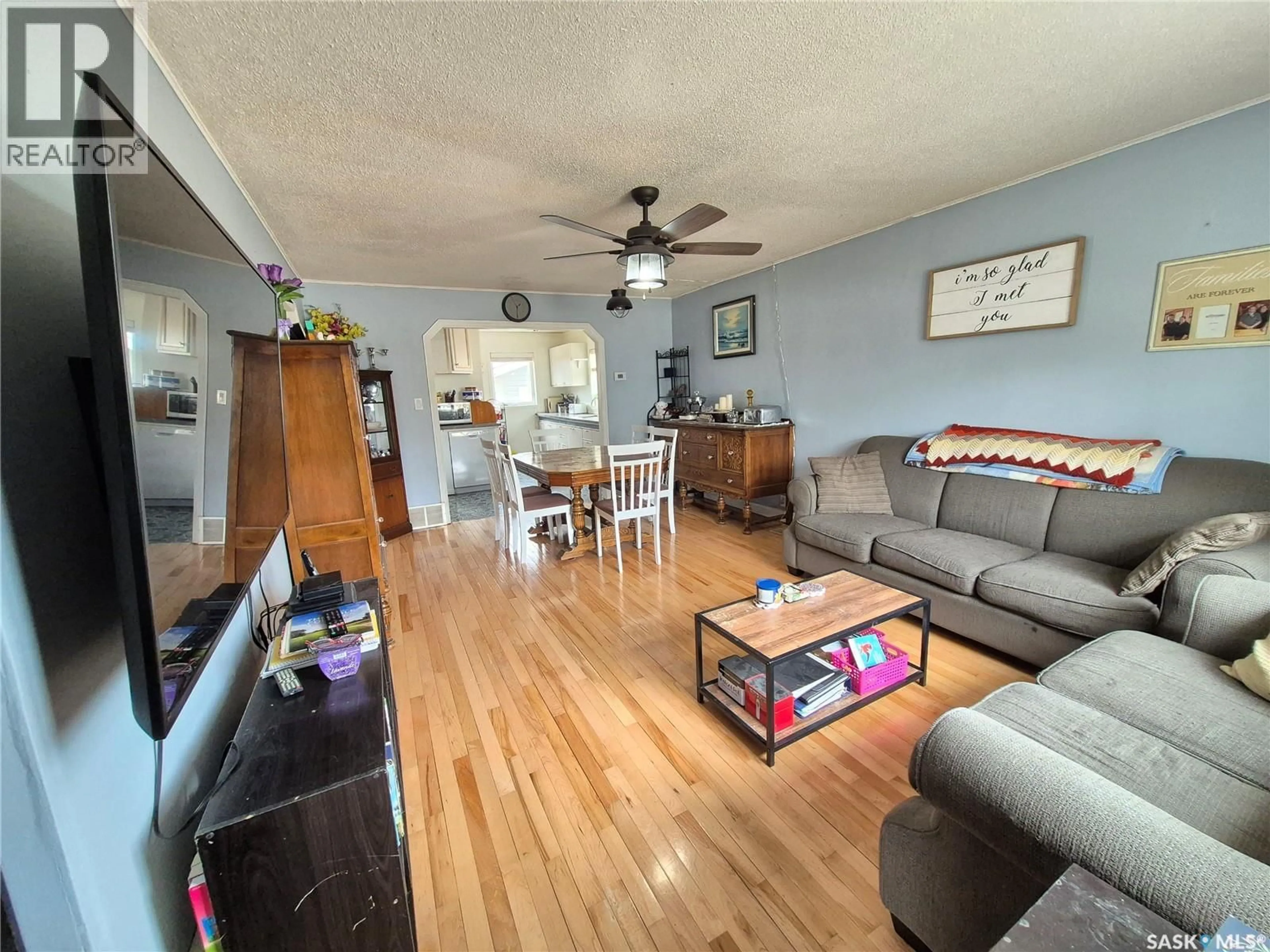 Living room with furniture, wood/laminate floor for 220 MILLET STREET, Yellow Grass Saskatchewan S0G5J0