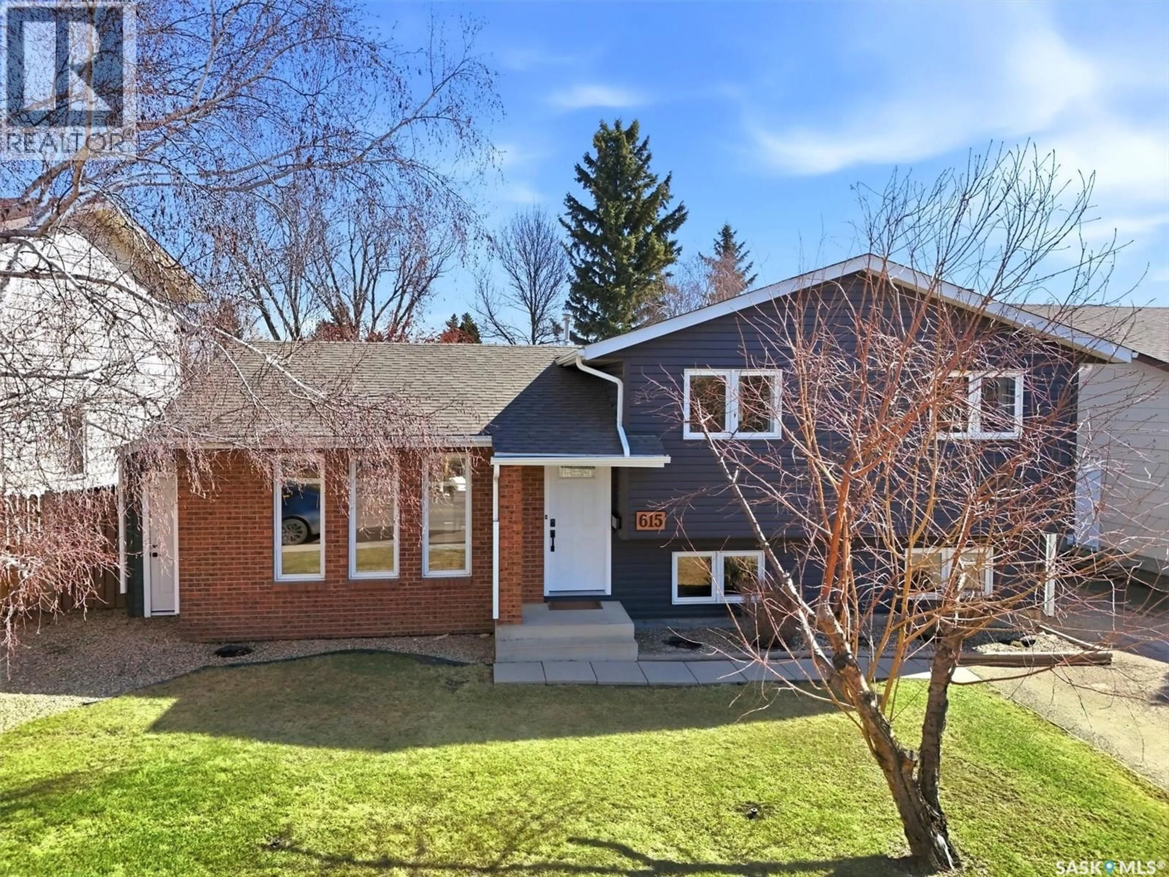 Home with brick exterior material, street for 615 KINGSMERE BOULEVARD, Saskatoon Saskatchewan S7J4E7
