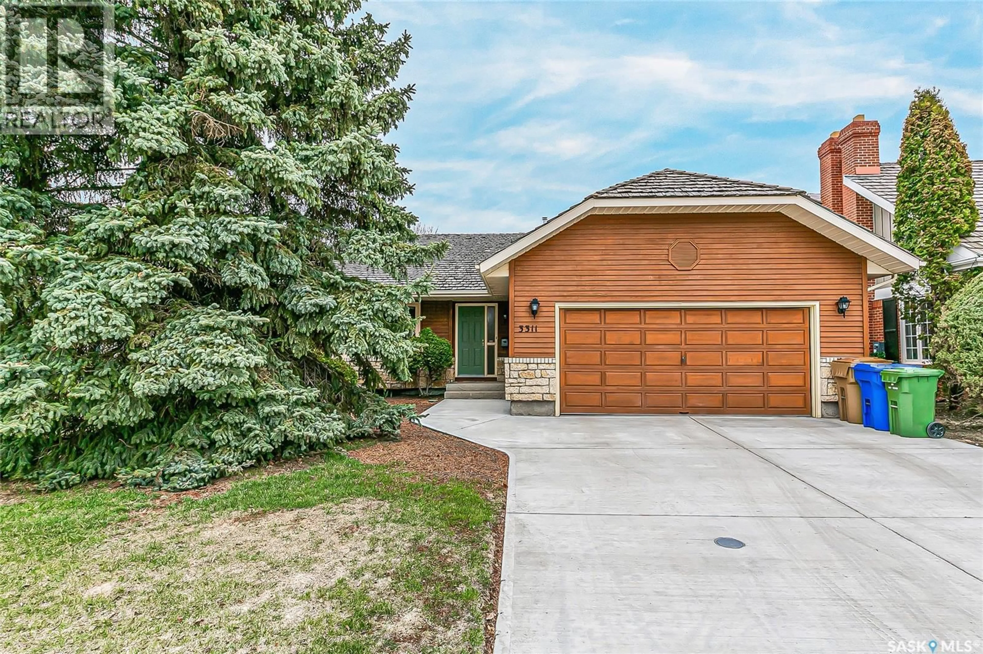 Home with brick exterior material, street for 3311 ROBINSON STREET, Regina Saskatchewan S4S1V9