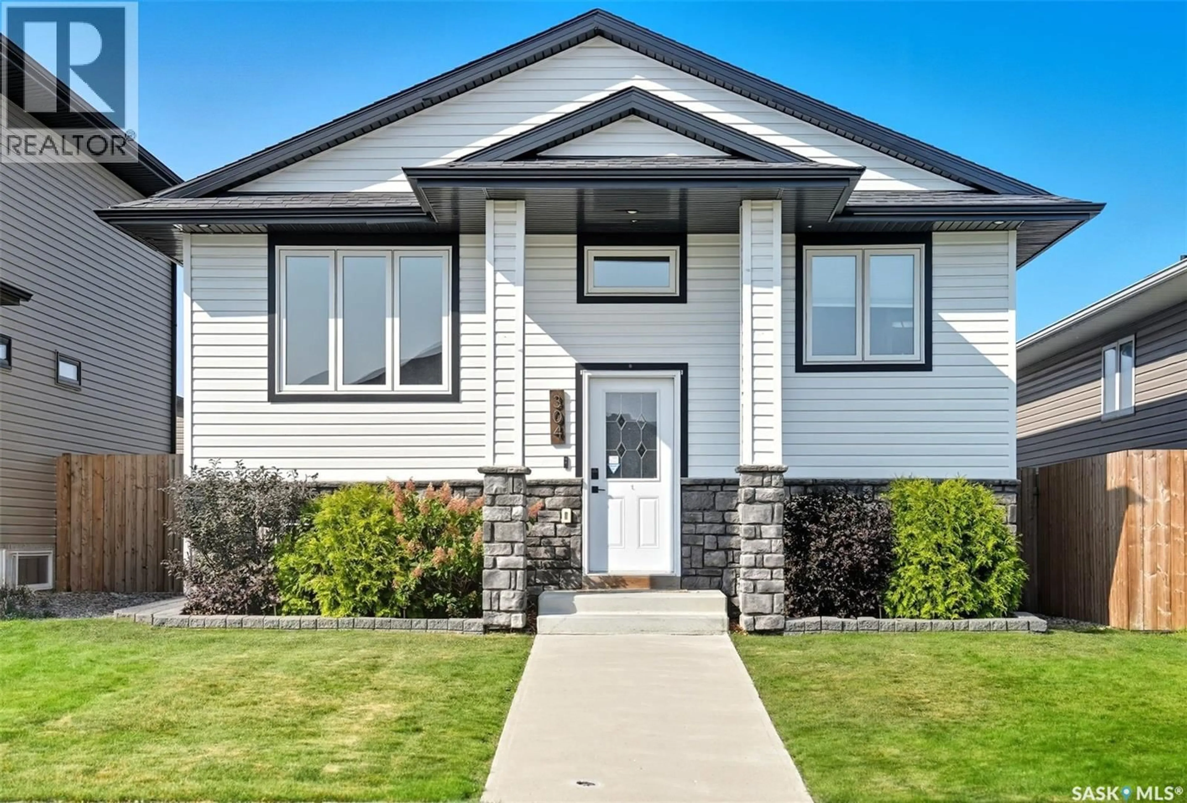 Home with vinyl exterior material, street for 304 MARTENS AVENUE, Warman Saskatchewan S0K4S3