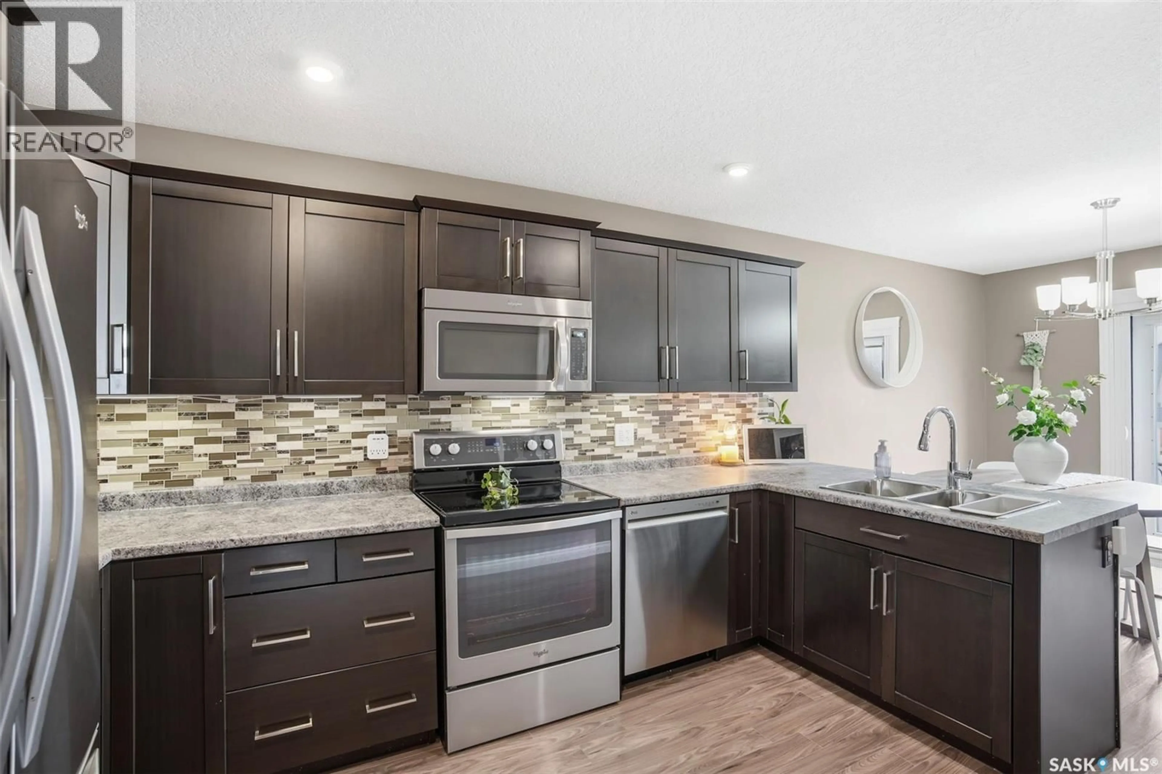 Open concept kitchen, ceramic/tile floor for 304 MARTENS AVENUE, Warman Saskatchewan S0K4S3
