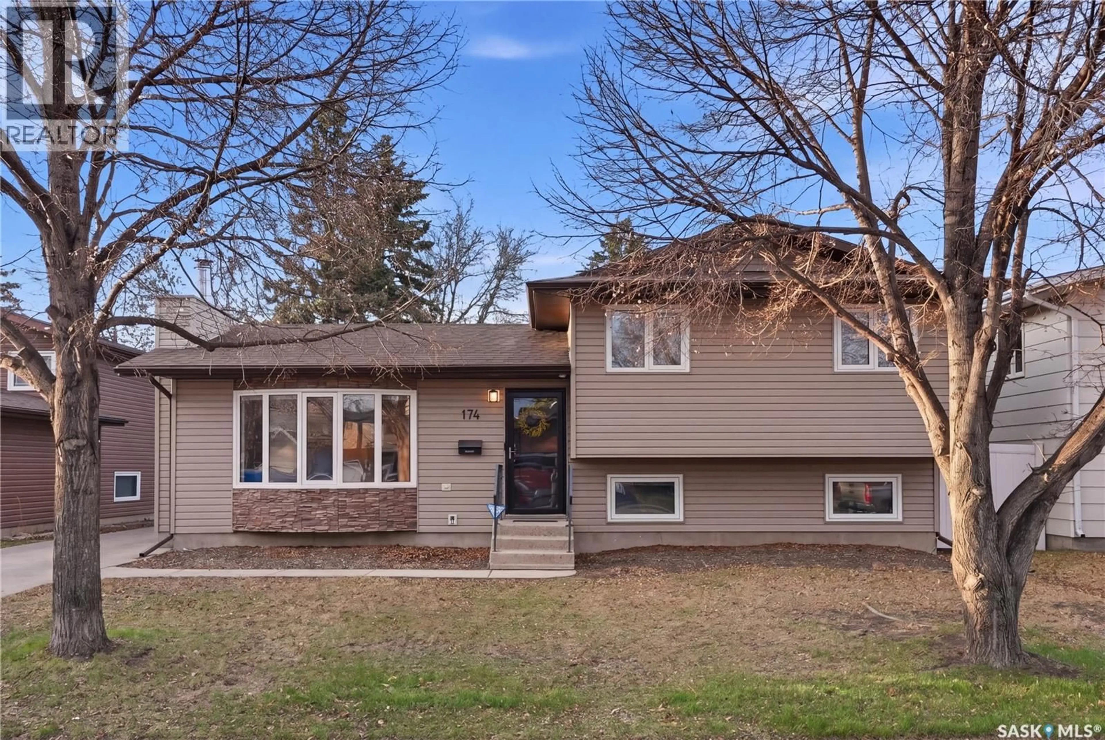 Home with vinyl exterior material, street for 174 RAO CRESCENT, Saskatoon Saskatchewan S7K6V9