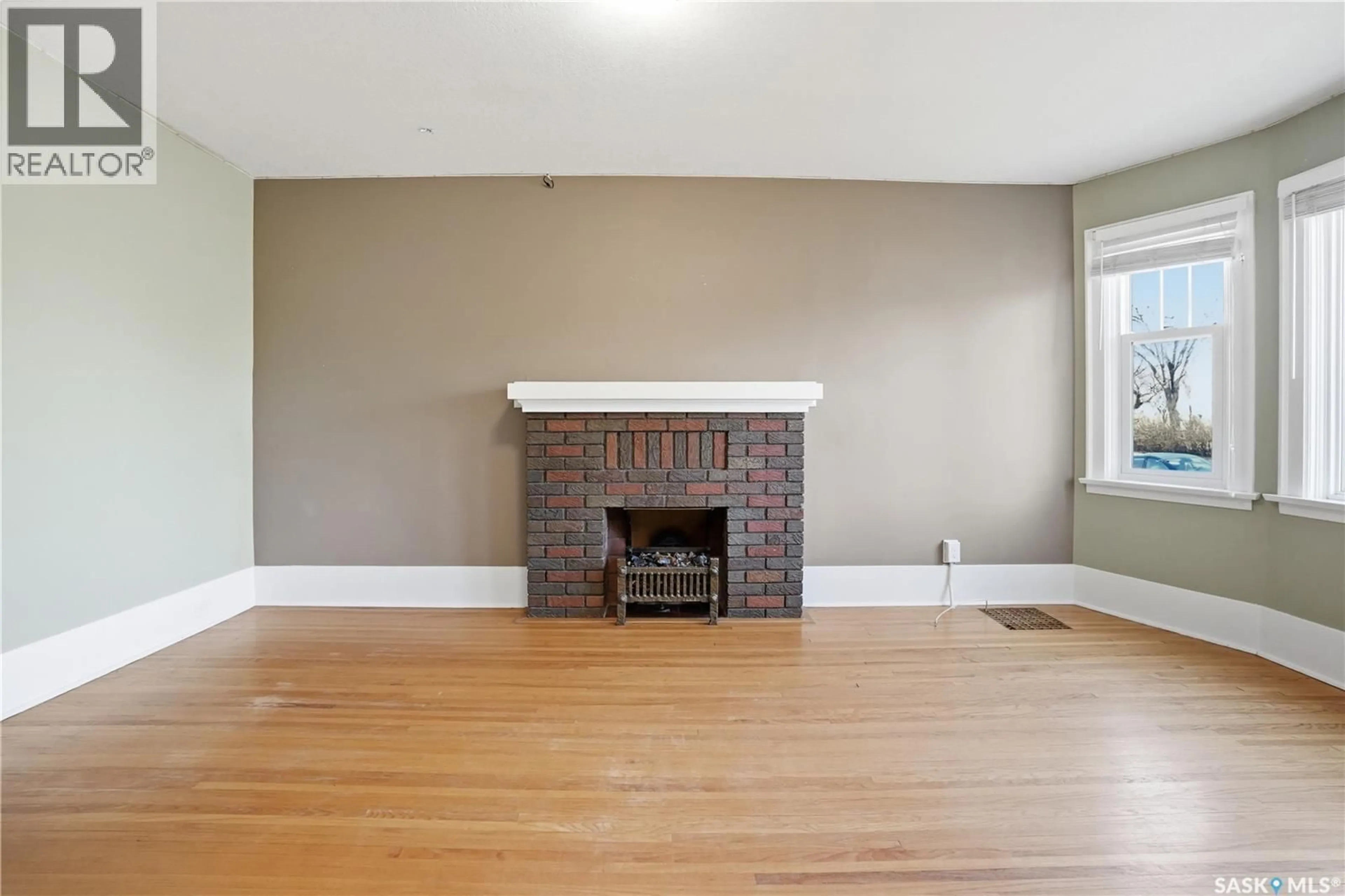 Living room with furniture, wood/laminate floor for 3727 VICTORIA AVENUE, Regina Saskatchewan S4T1M5