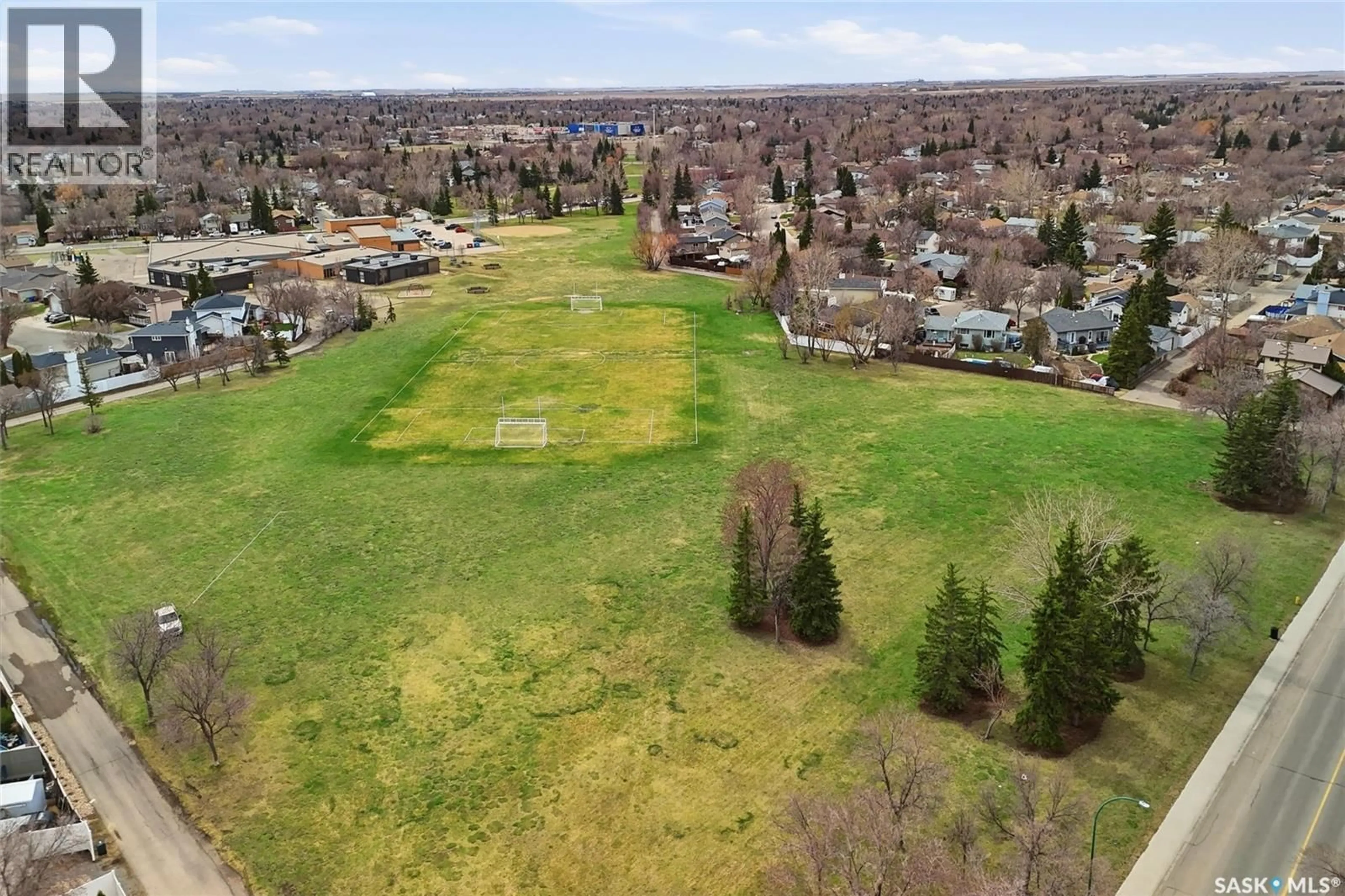 A pic from outside/outdoor area/front of a property/back of a property/a pic from drone, mountain view for 404 DALGLIESH DRIVE, Regina Saskatchewan S4R6J1