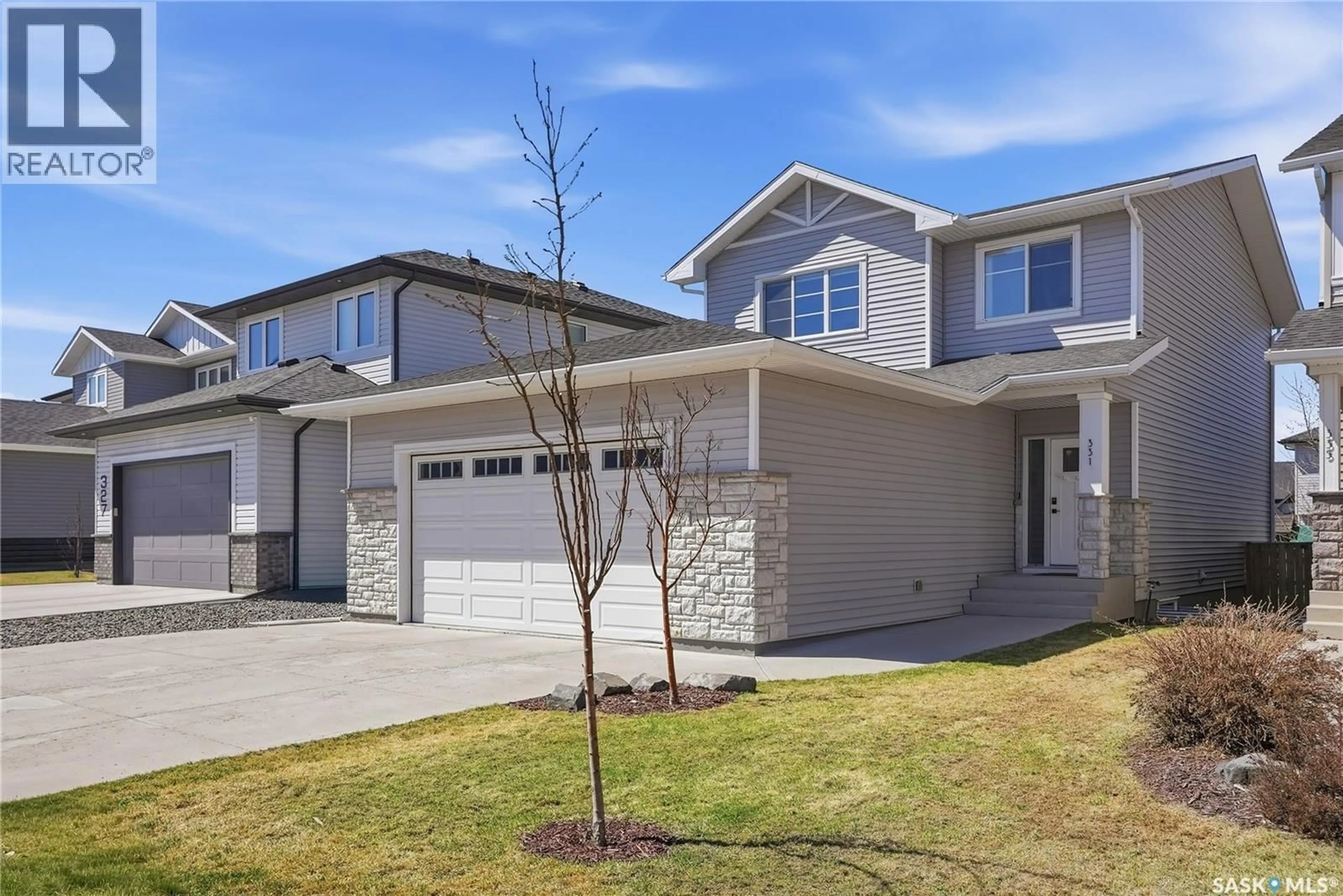 Home with vinyl exterior material, street for 331 UNDERHILL BEND, Saskatoon Saskatchewan S7V0M9