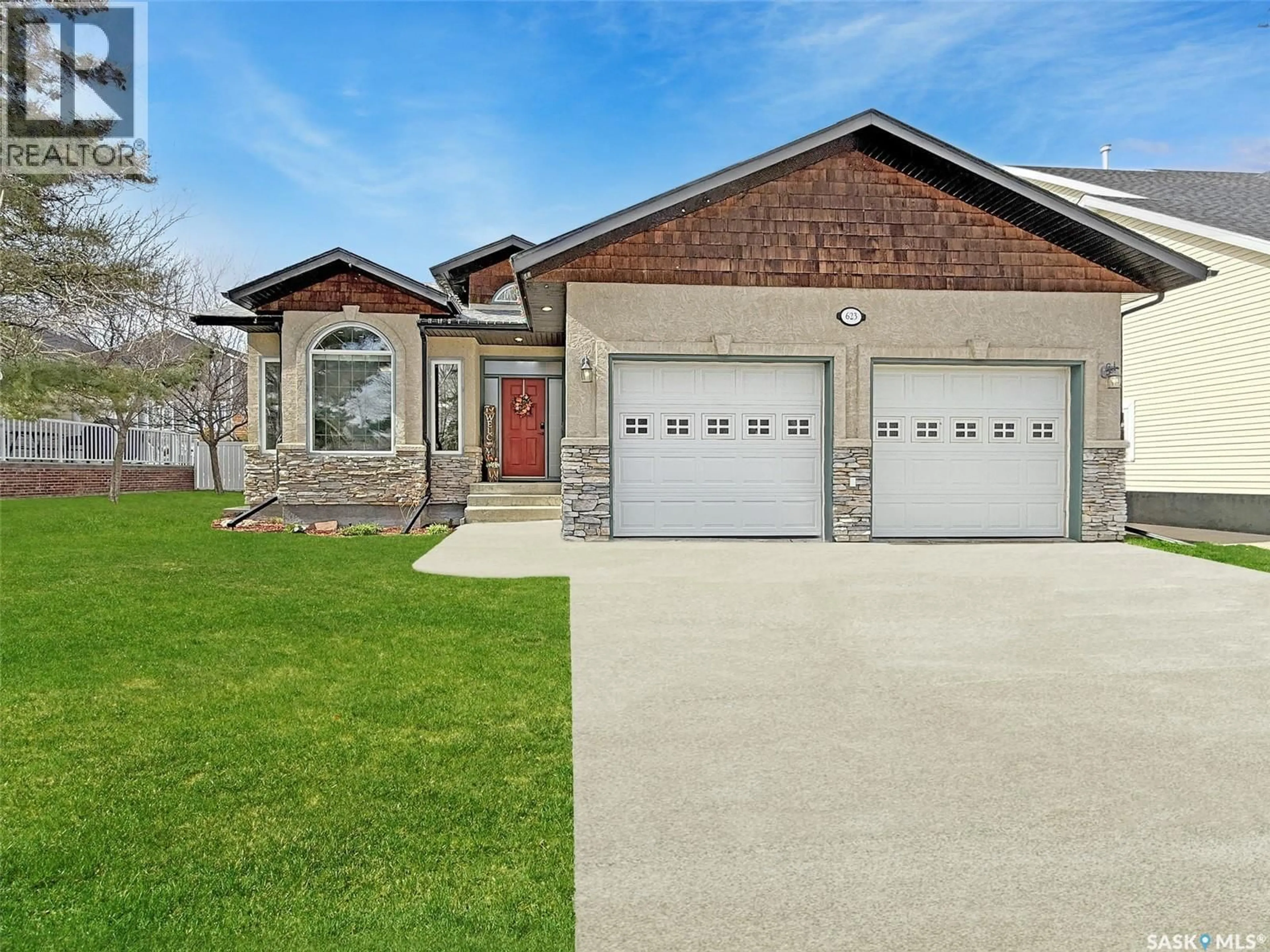 Home with brick exterior material, street for 623 HIGHLAND DRIVE, Swift Current Saskatchewan S9H4Z5