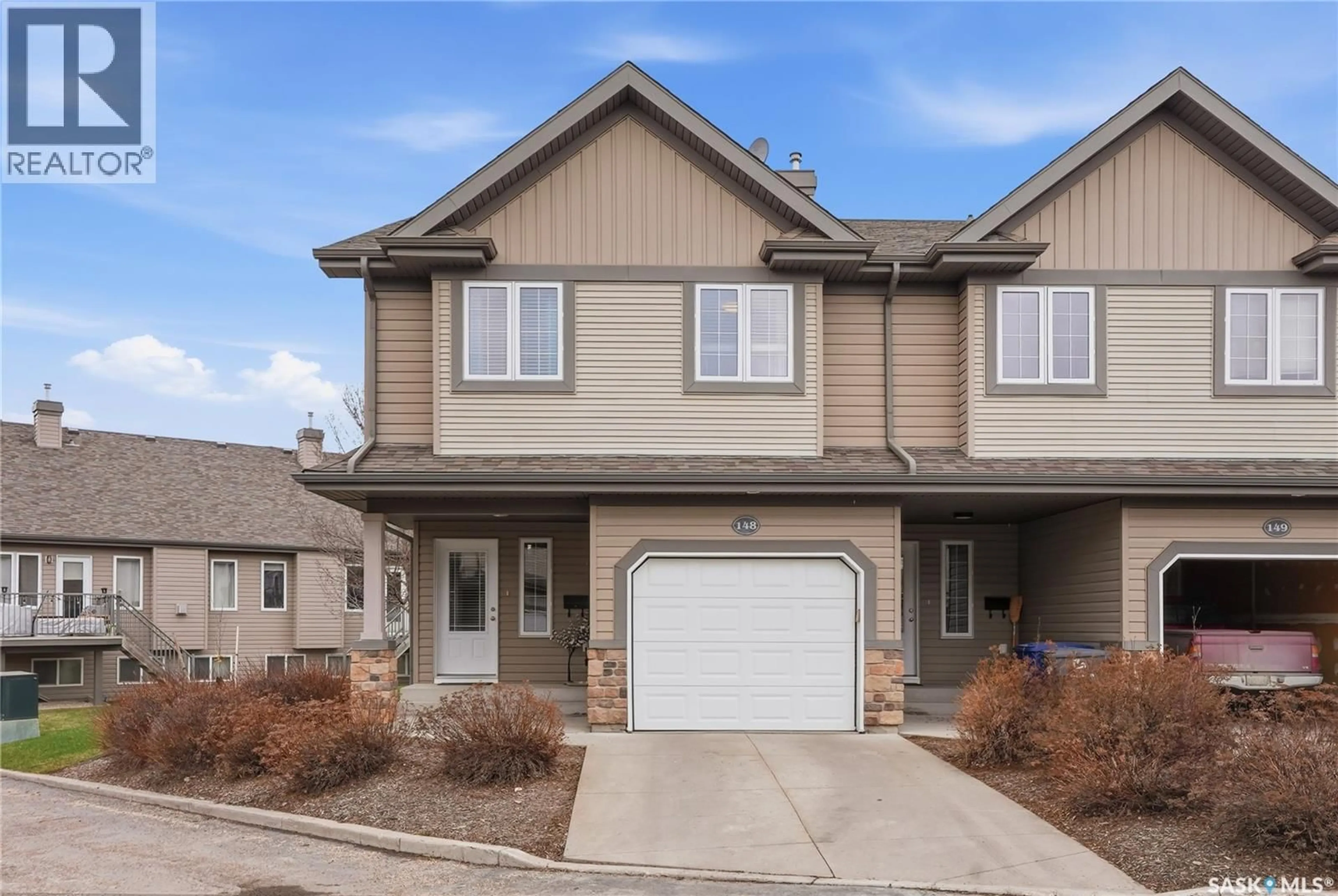 Home with vinyl exterior material, street for 615 - 148 STENSRUD ROAD, Saskatoon Saskatchewan S7W0A2