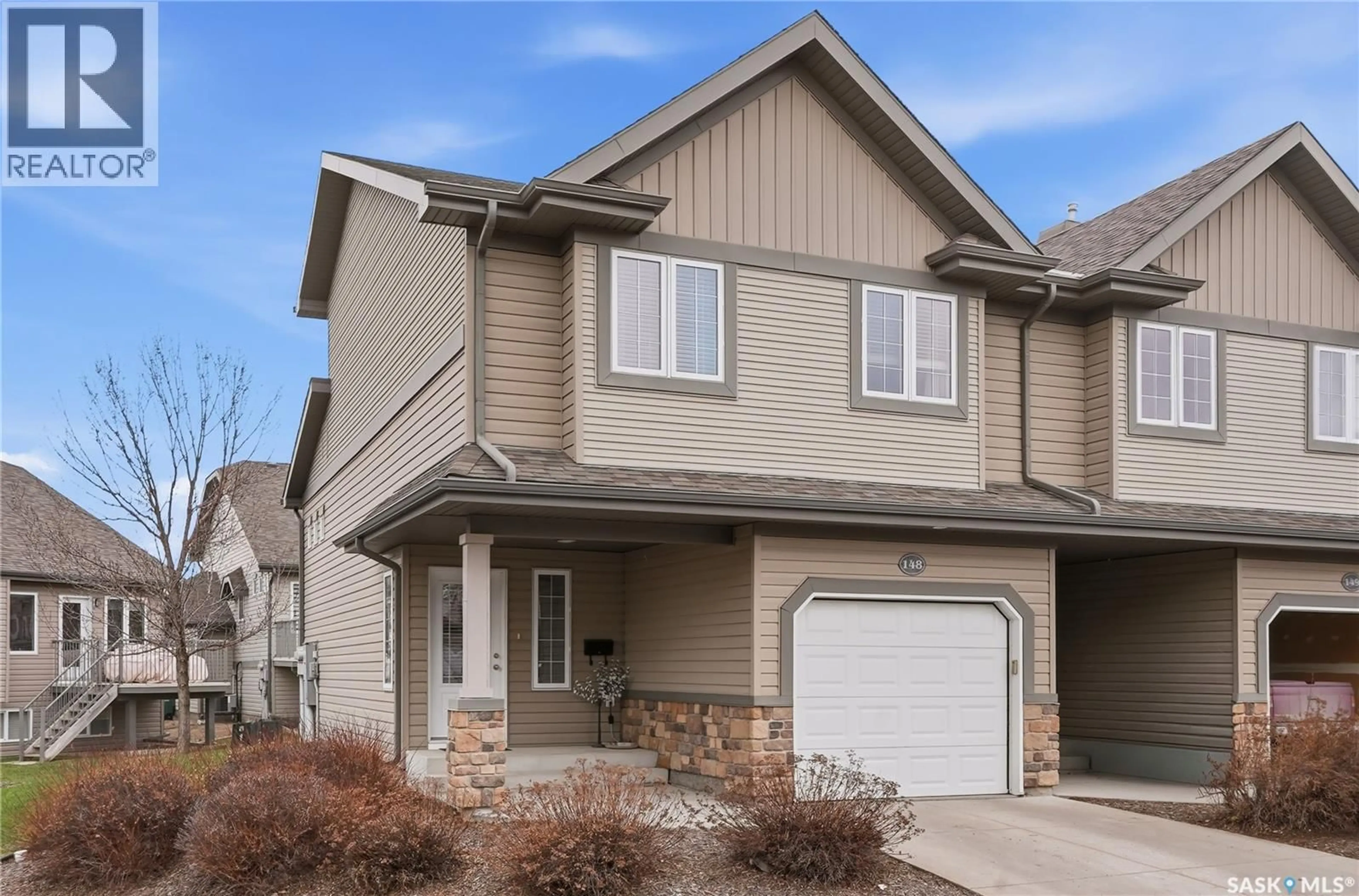 Home with vinyl exterior material, street for 615 - 148 STENSRUD ROAD, Saskatoon Saskatchewan S7W0A2