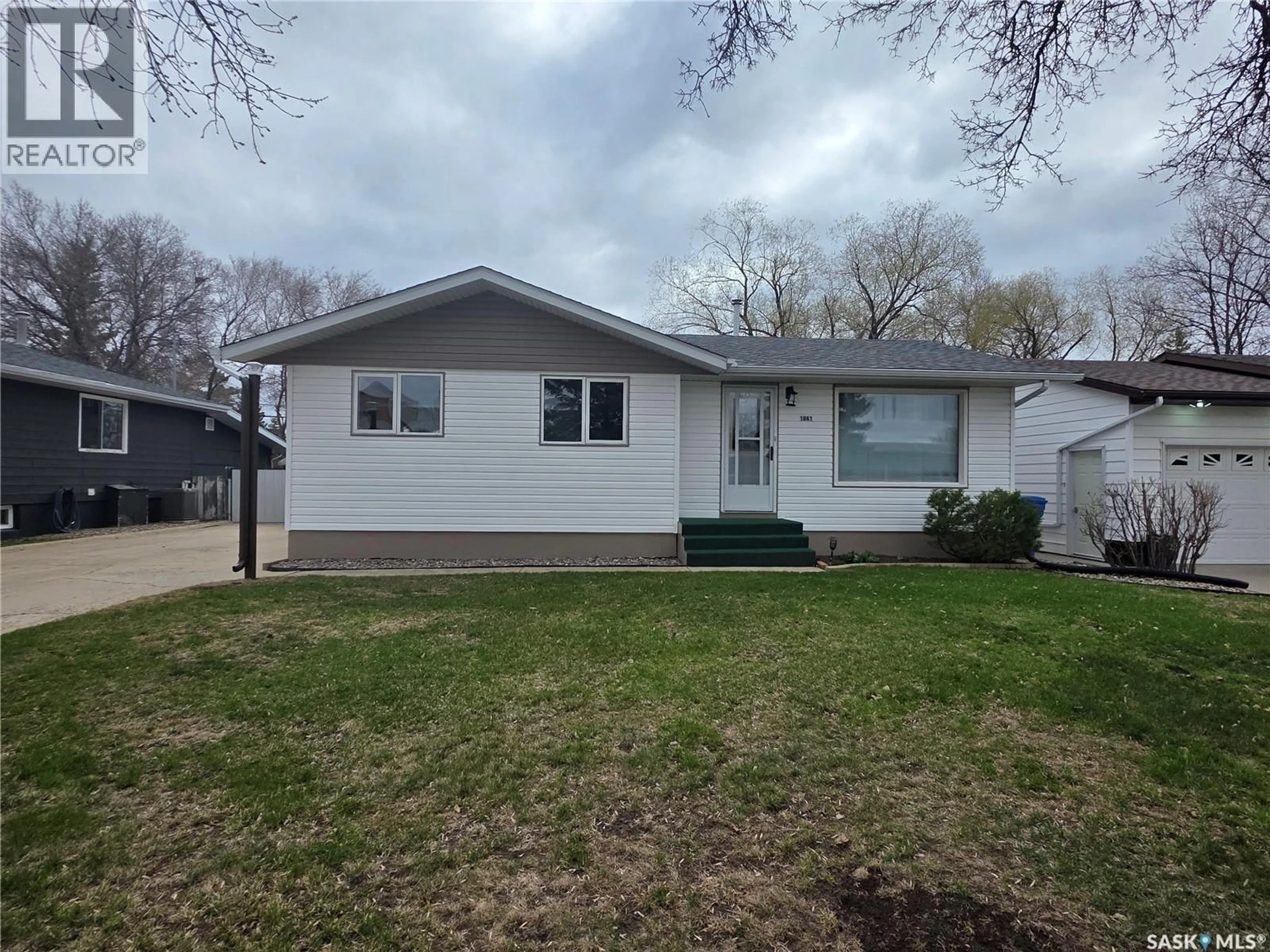 Home with vinyl exterior material, street for 1841 GIBBS ROAD, Estevan Saskatchewan S4A1Y1