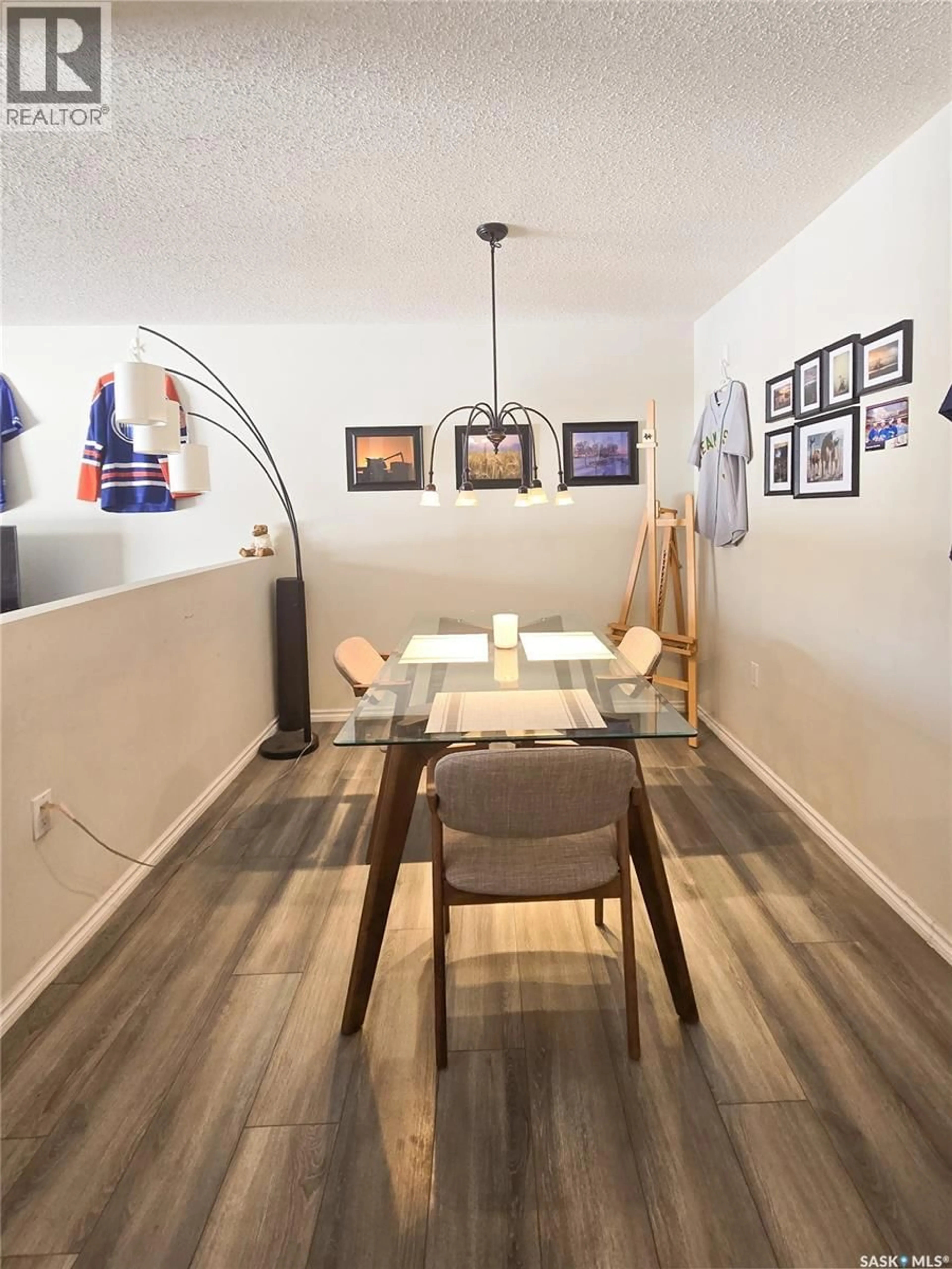 Dining room, wood/laminate floor for 108 2931 HARDING STREET, Regina Saskatchewan S4R1A6