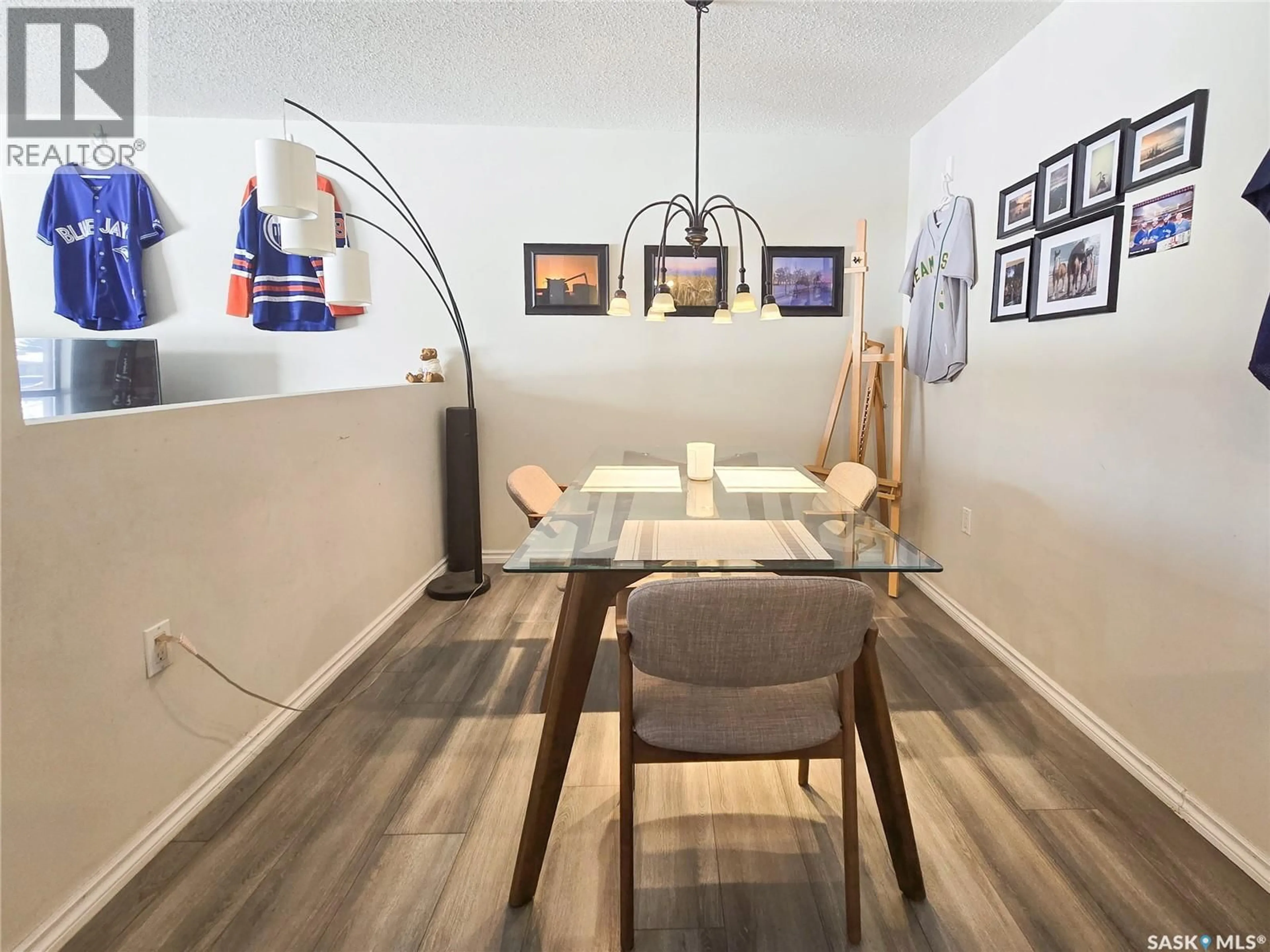 Dining room, wood/laminate floor for 108 2931 HARDING STREET, Regina Saskatchewan S4R1A6
