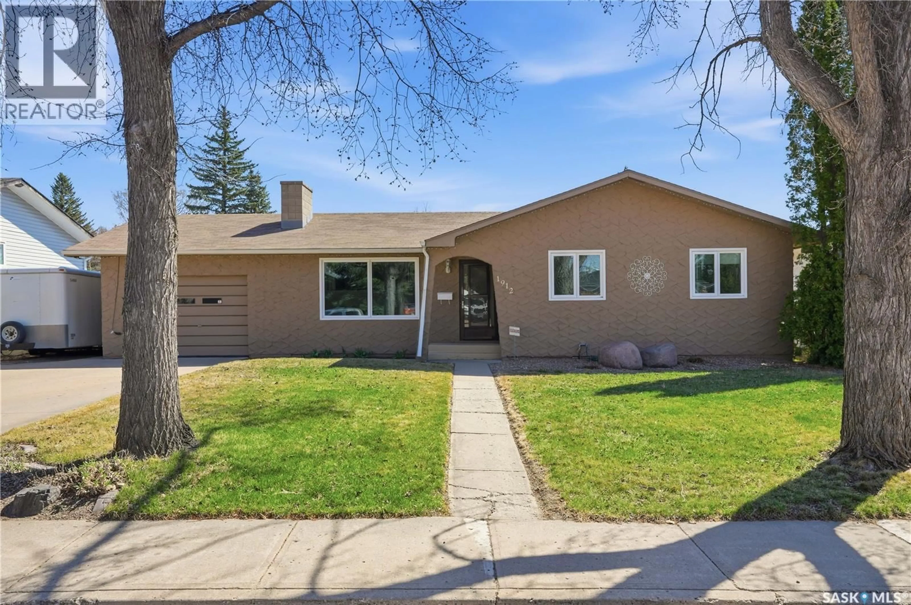 Home with vinyl exterior material, street for 1912 95TH STREET, North Battleford Saskatchewan S9A3C7