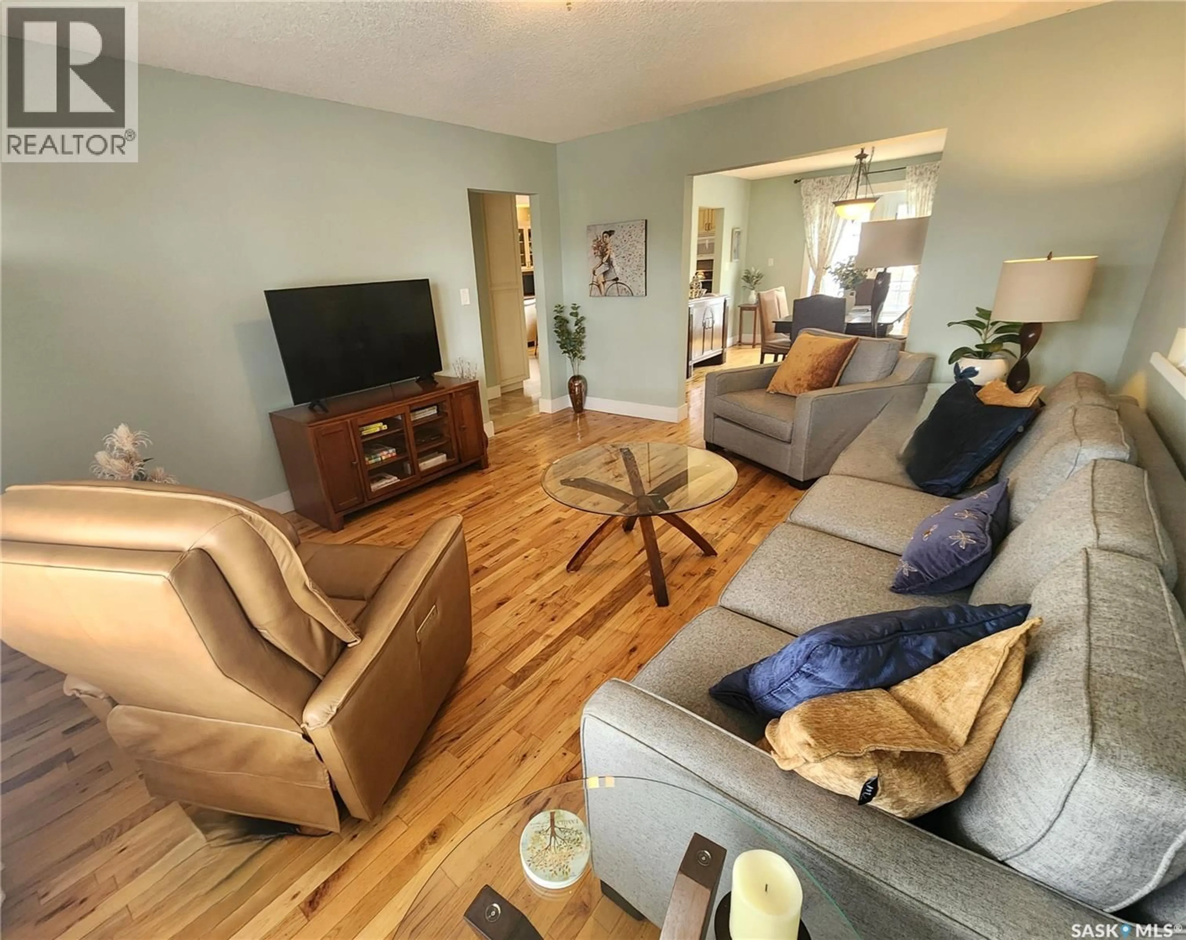 Living room with furniture, wood/laminate floor for 947 ALBERT STREET, Estevan Saskatchewan S4A1S2