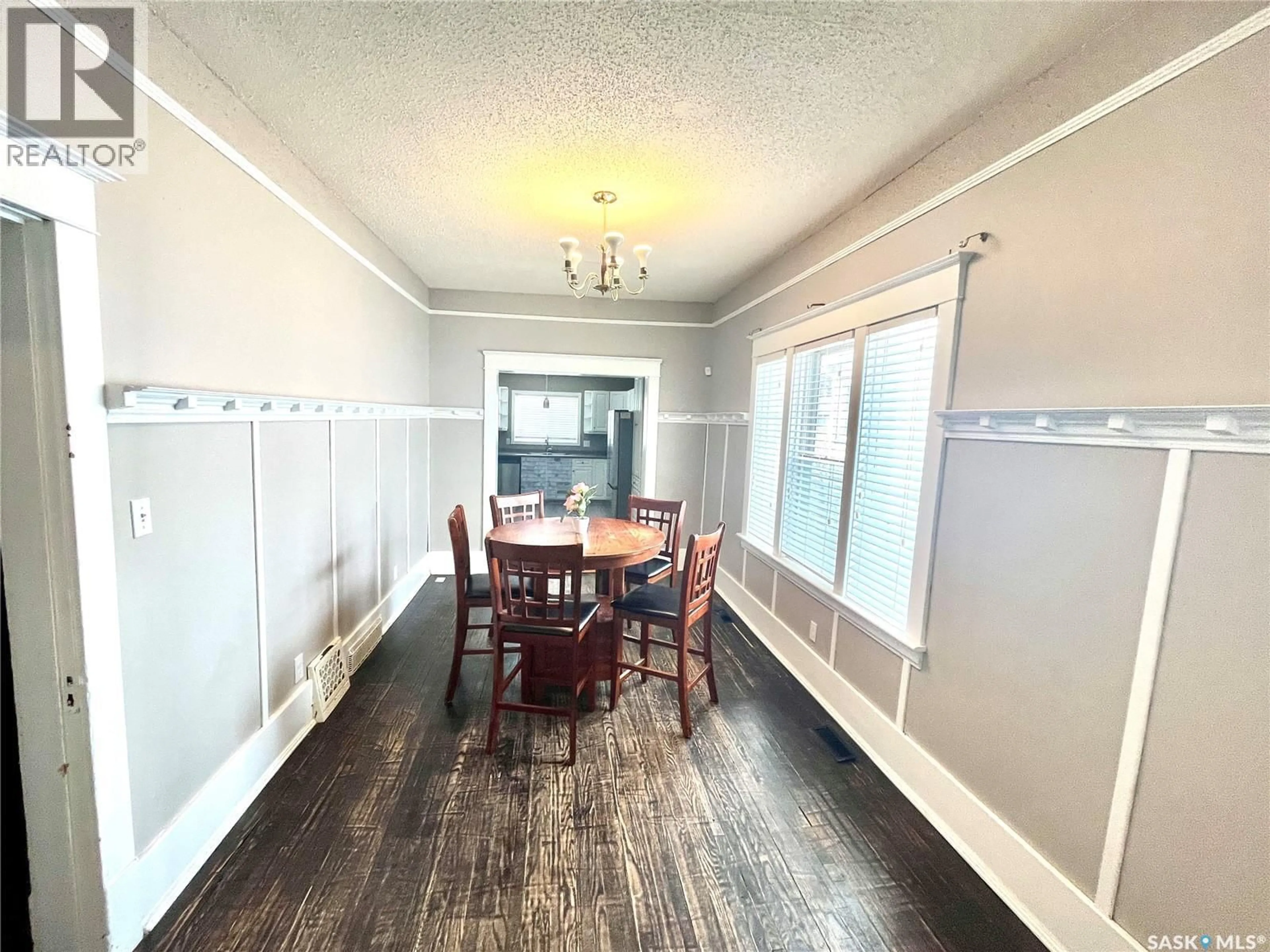 Dining room, wood/laminate floor for 719 I AVENUE, Saskatoon Saskatchewan S7M1Z1