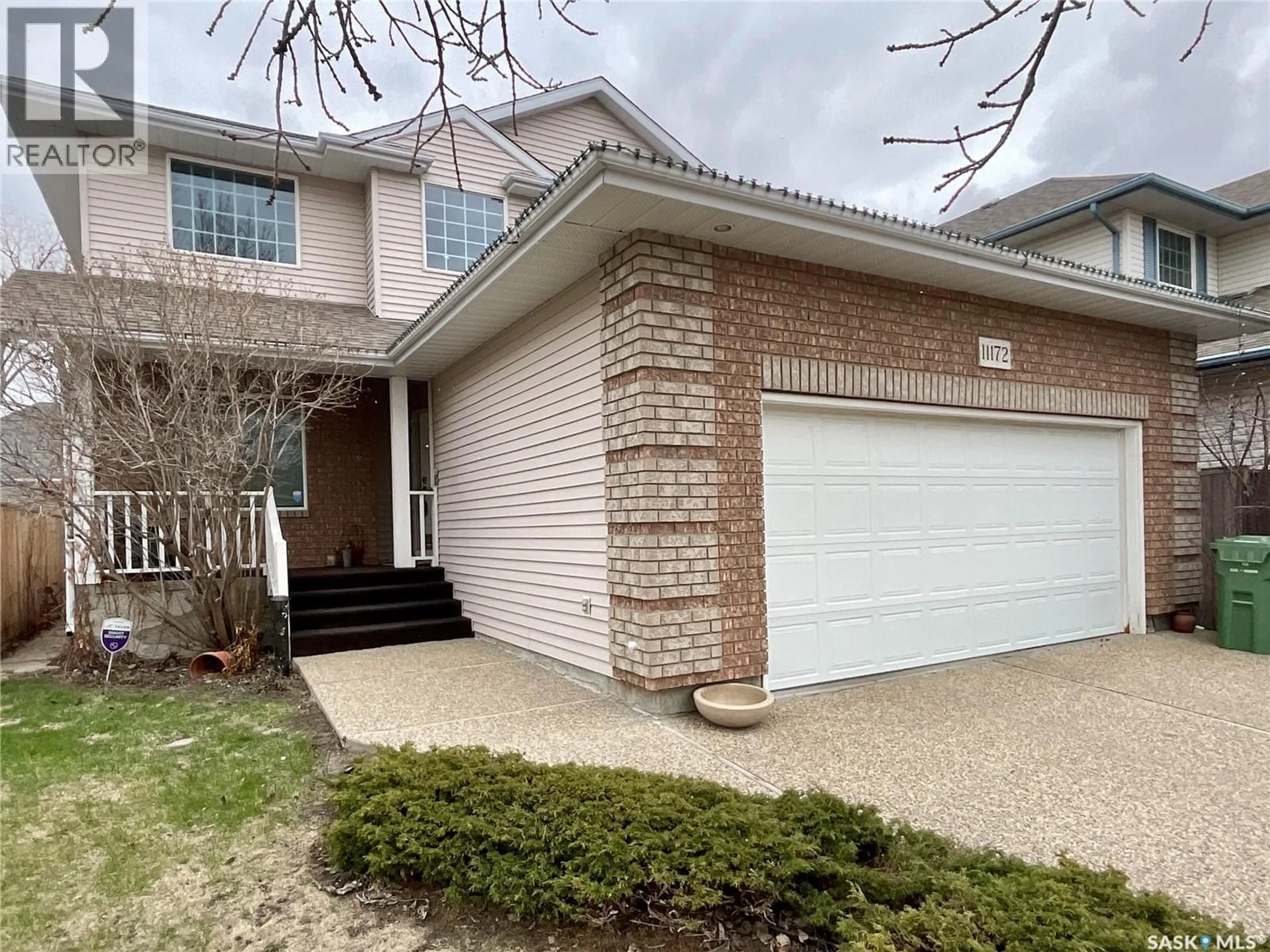 Home with brick exterior material, street for 11172 WASCANA MEADOWS, Regina Saskatchewan S4V2W2