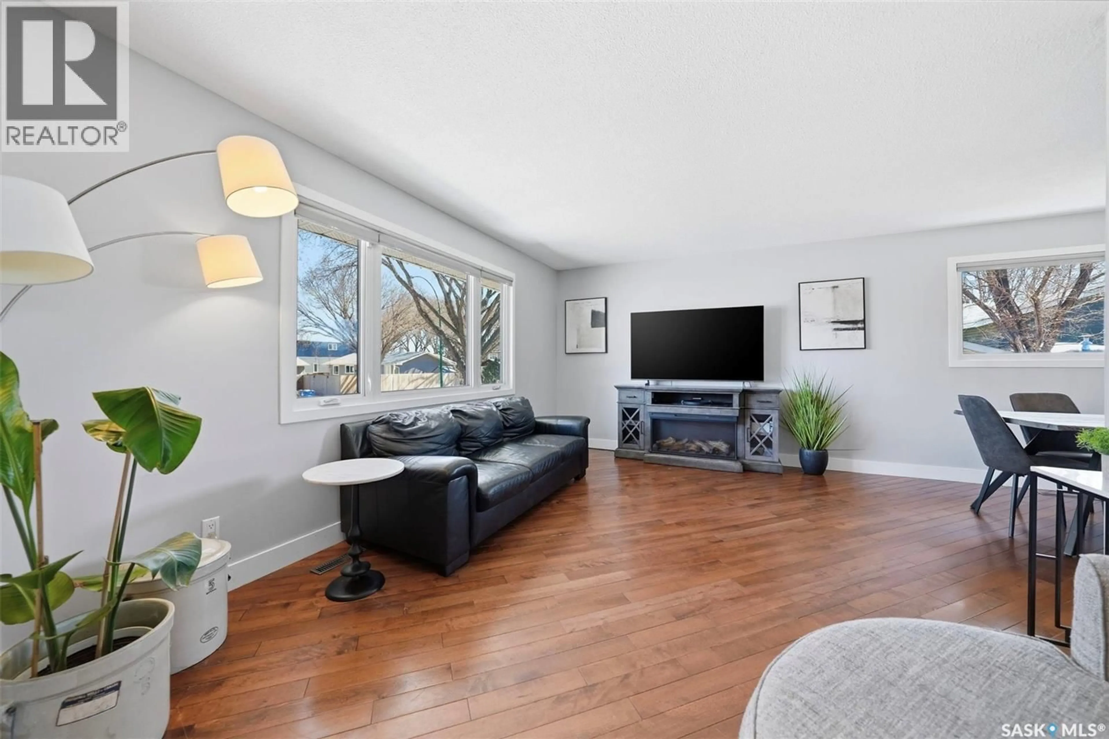 Living room with furniture, wood/laminate floor for 1 RUPERT DRIVE, Saskatoon Saskatchewan S7K1B1