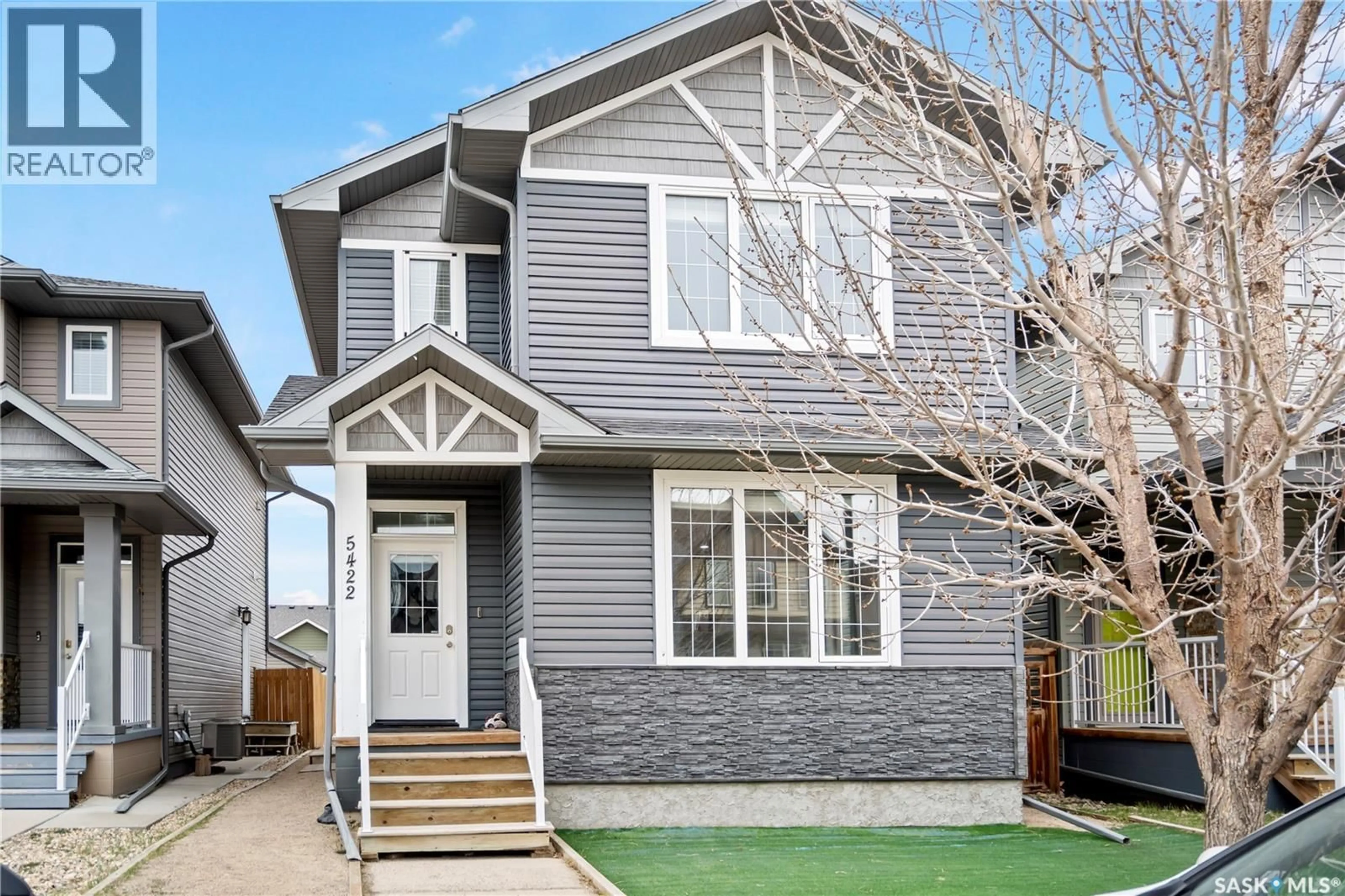 Home with vinyl exterior material, street for 5422 WHEREATT ROAD, Regina Saskatchewan S4W0K4