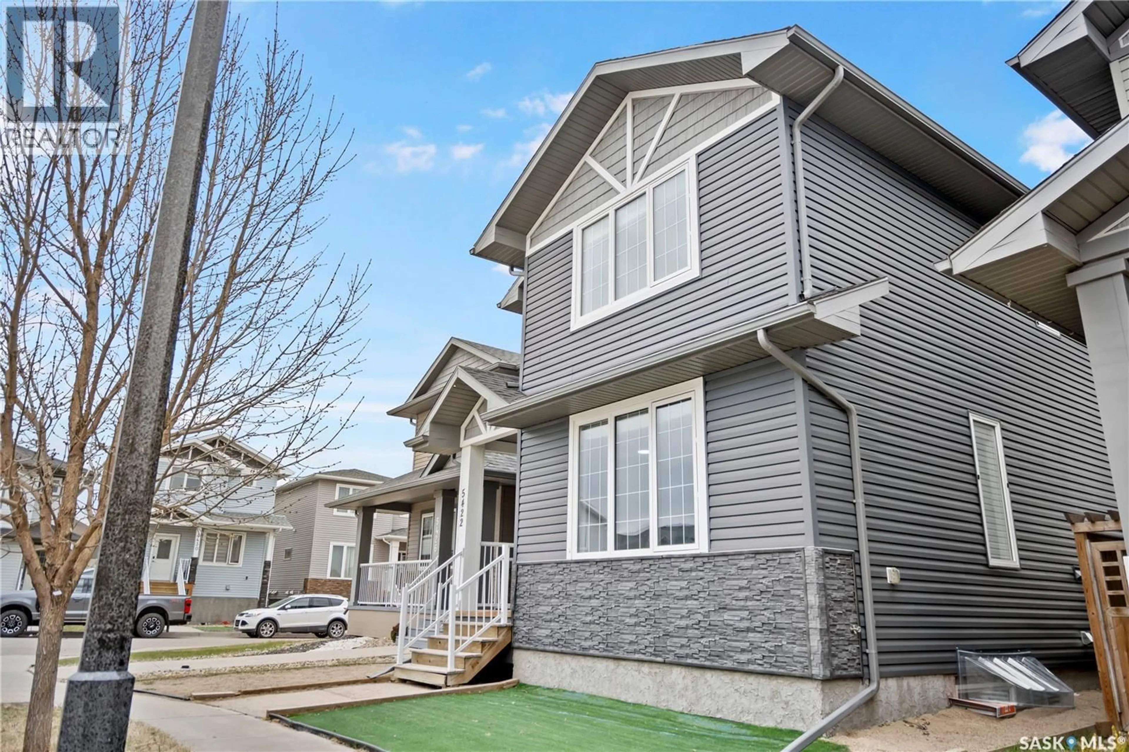 Home with vinyl exterior material, street for 5422 WHEREATT ROAD, Regina Saskatchewan S4W0K4
