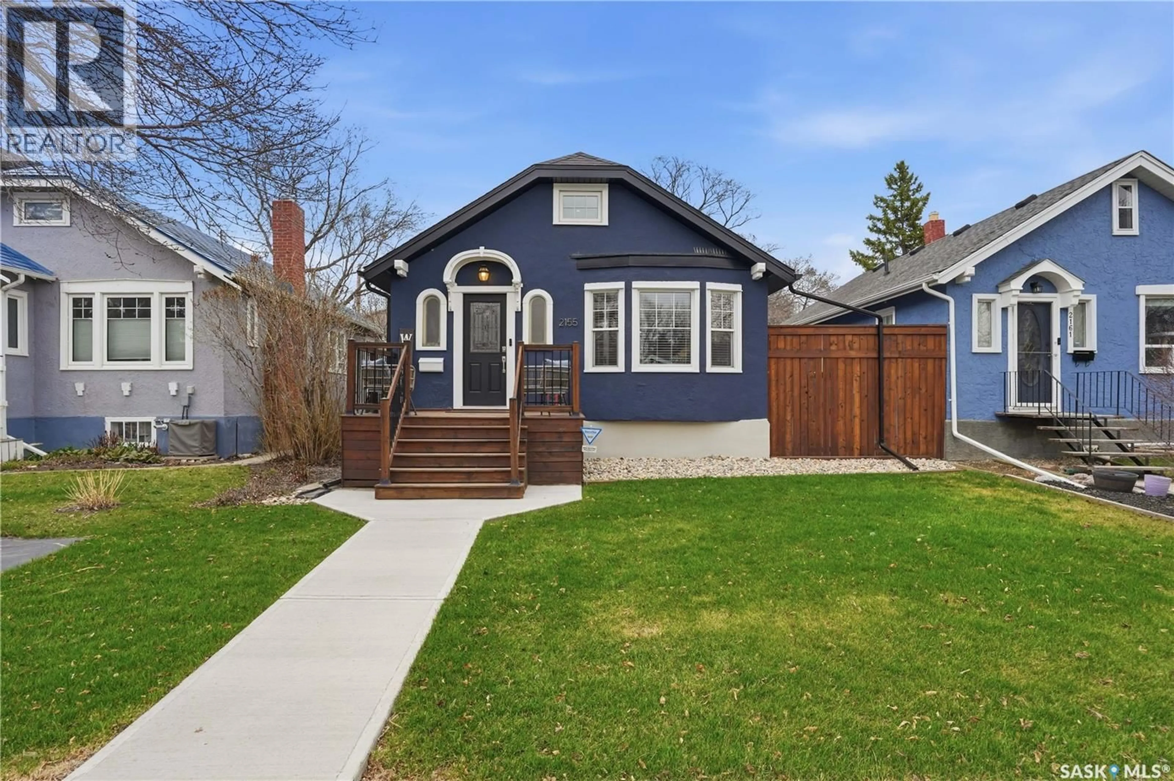 Home with vinyl exterior material, street for 2155 QUEEN STREET, Regina Saskatchewan S4T4C4