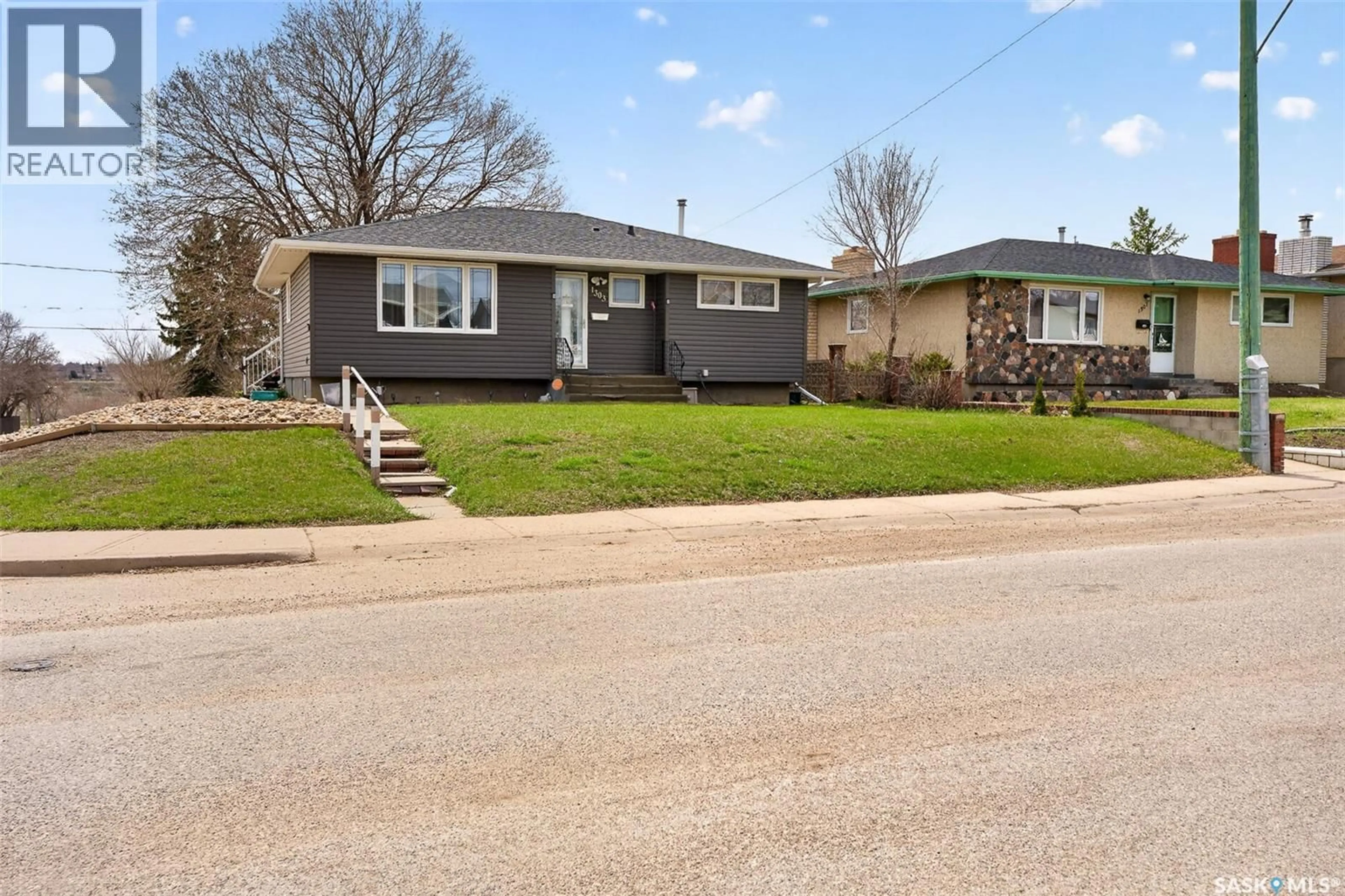 Home with vinyl exterior material, street for 1303 ATHABASCA STREET, Moose Jaw Saskatchewan S6H6C8