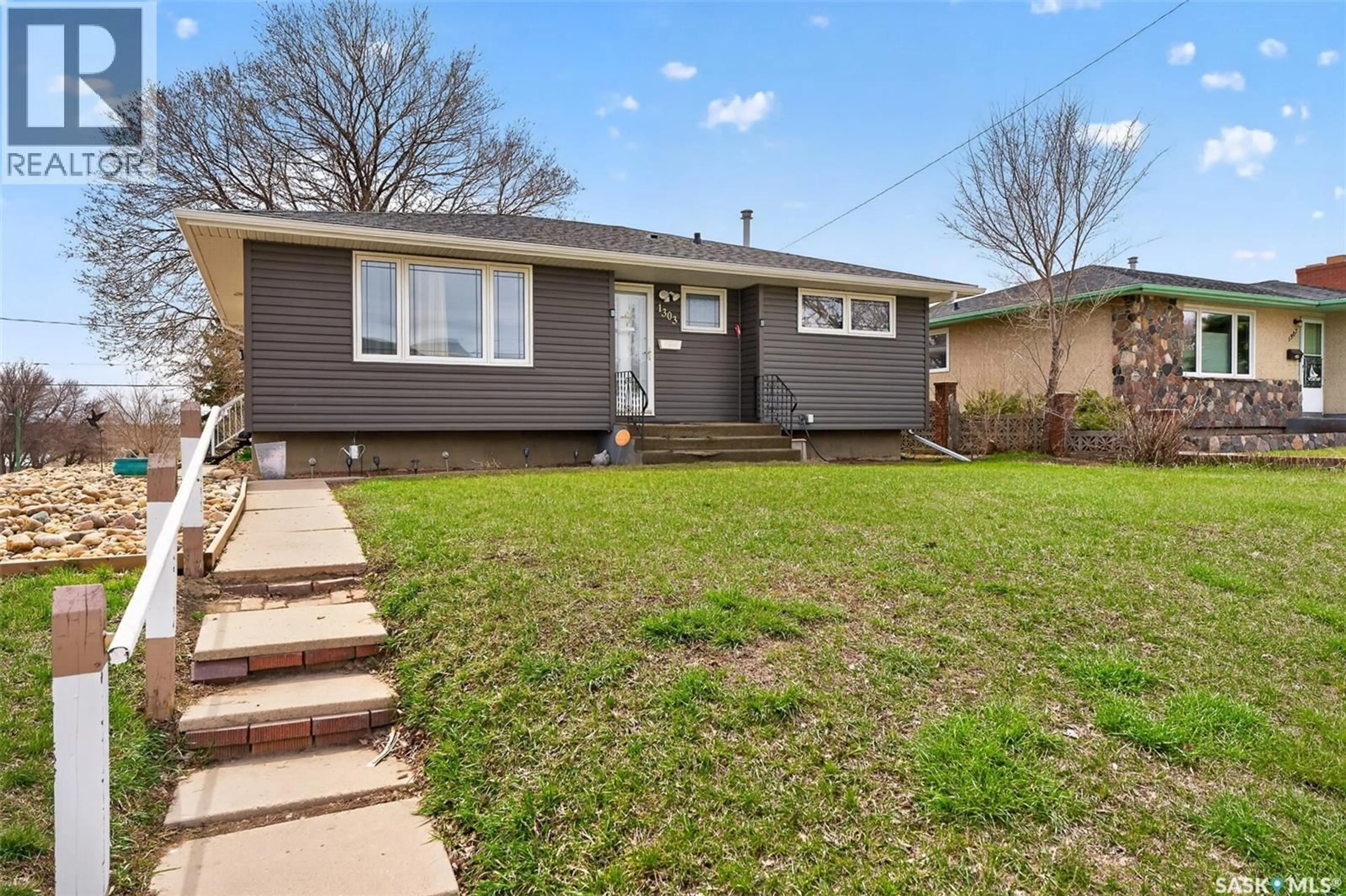Home with vinyl exterior material, street for 1303 ATHABASCA STREET, Moose Jaw Saskatchewan S6H6C8