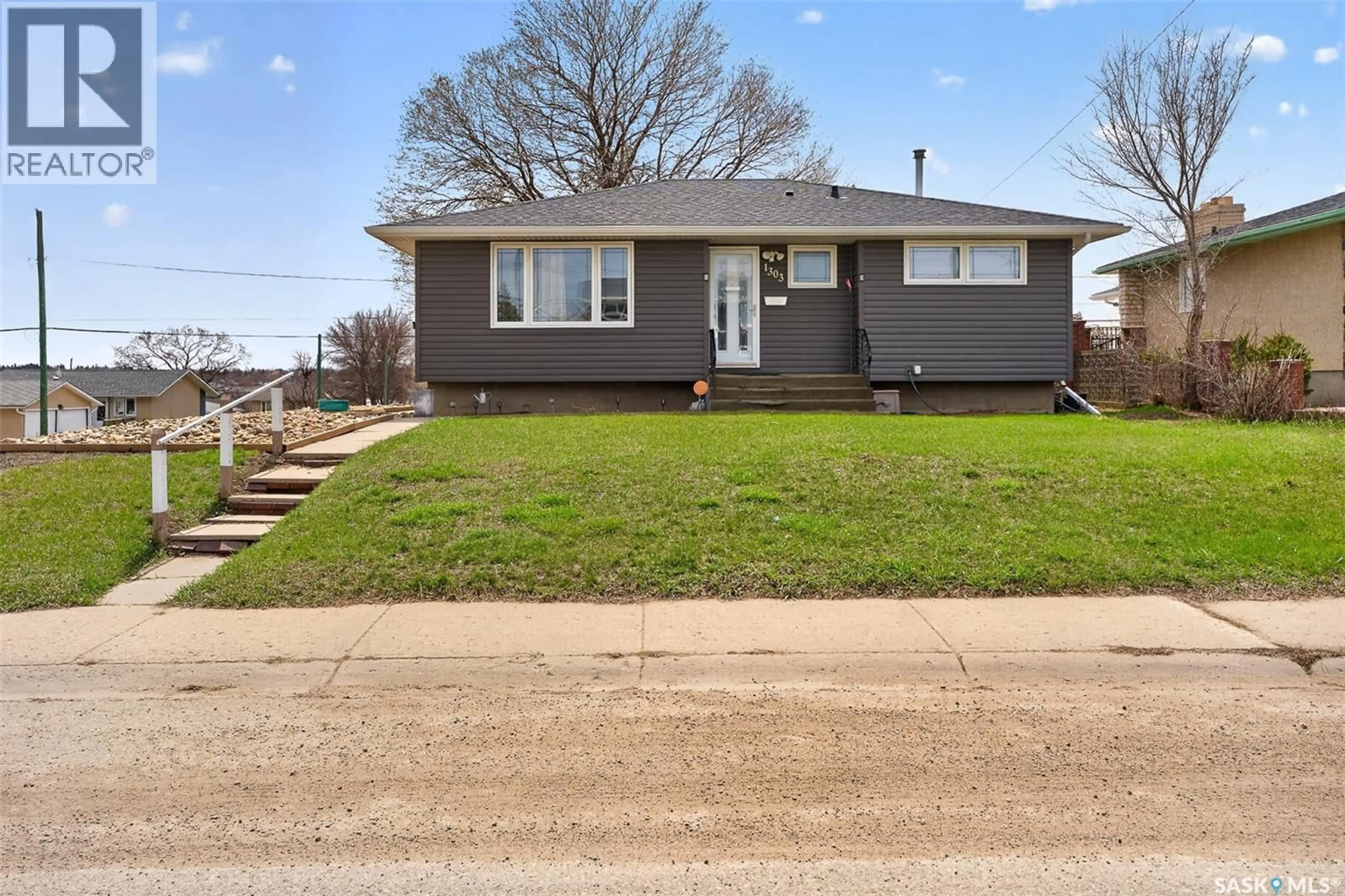Home with vinyl exterior material, street for 1303 ATHABASCA STREET, Moose Jaw Saskatchewan S6H6C8