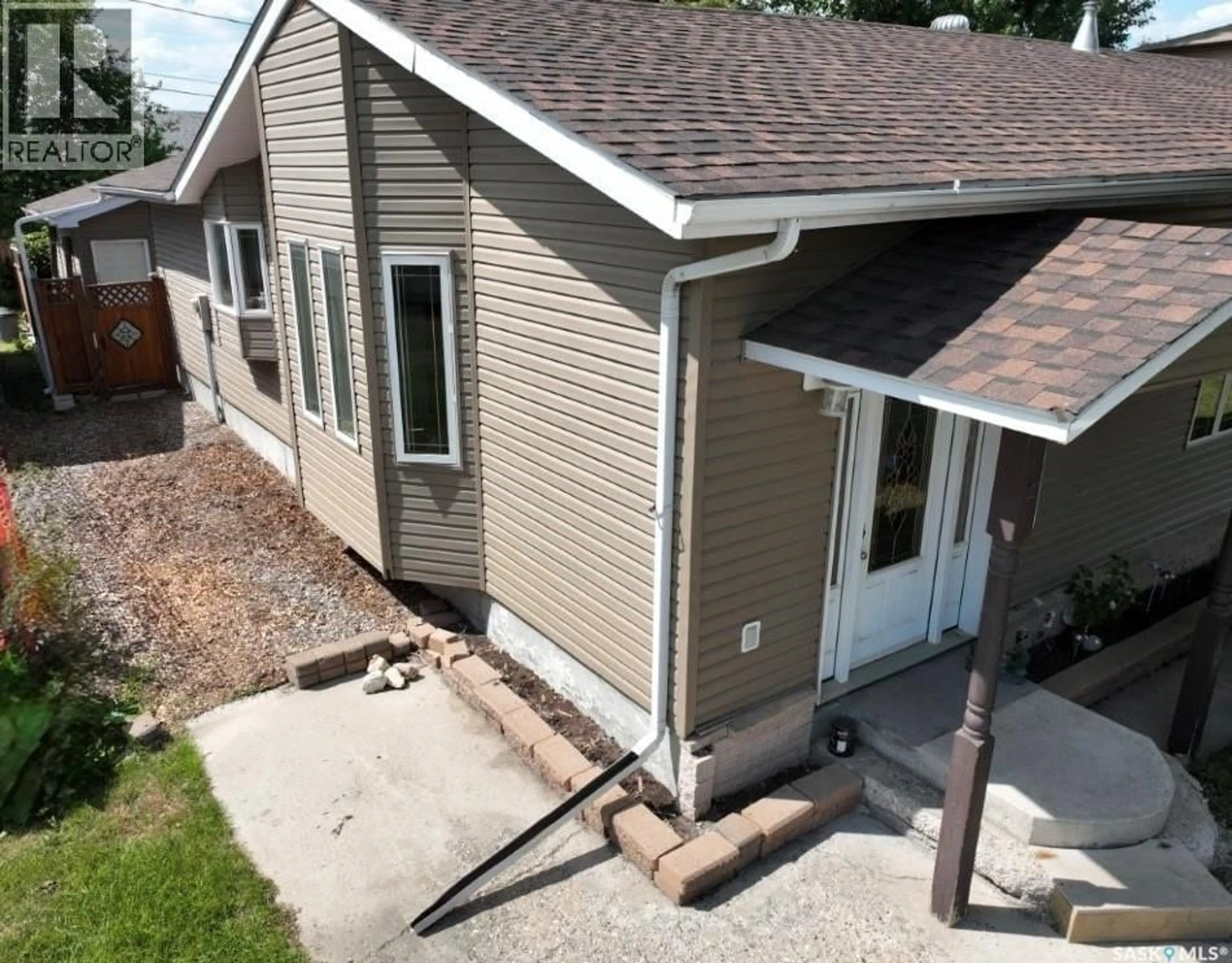 Home with vinyl exterior material, street for 513 HUDSON STREET, Hudson Bay Saskatchewan S0E0Y0