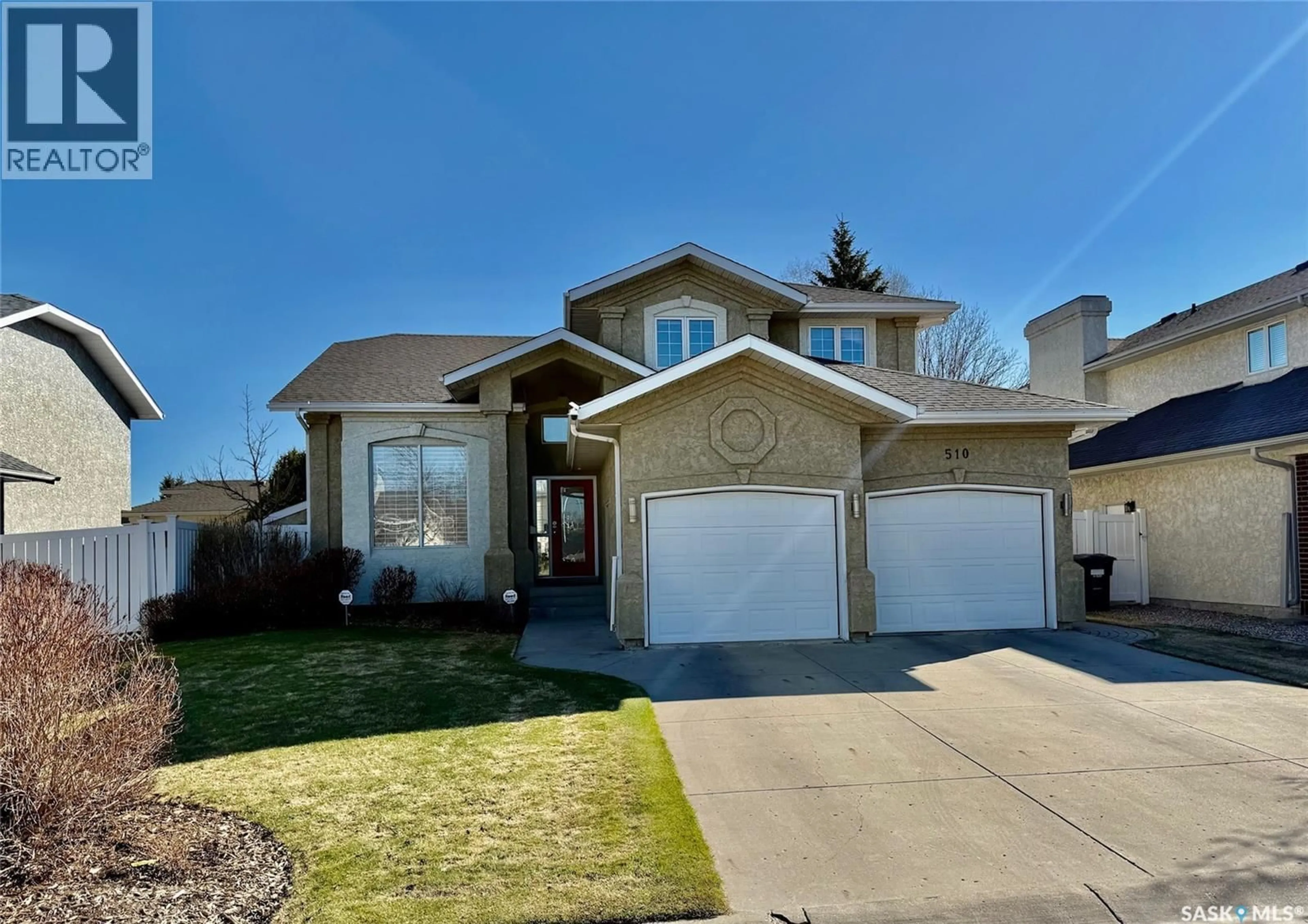 Home with vinyl exterior material, street for 510 EASTMAN COVE, Saskatoon Saskatchewan S7N4K9