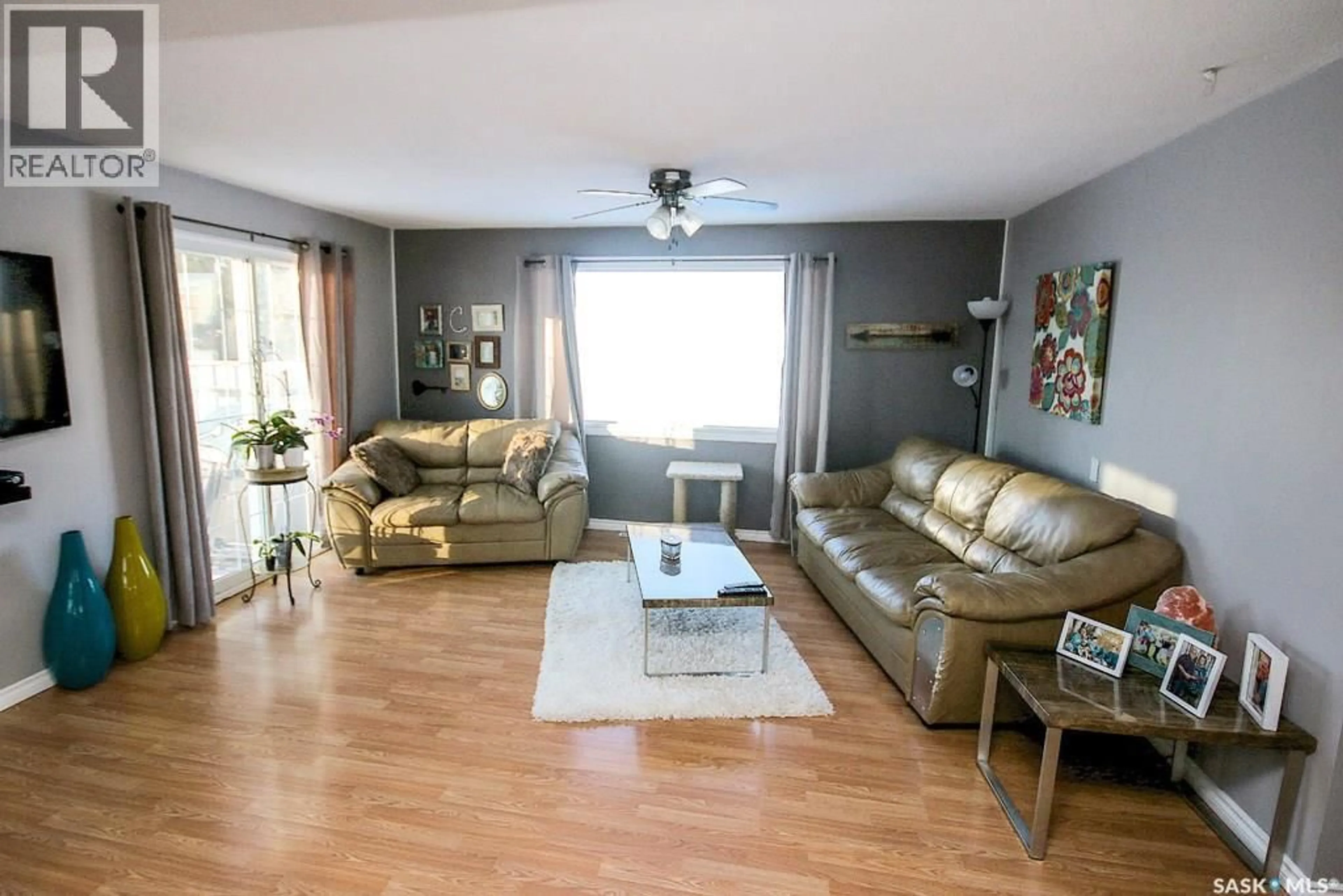 Living room with furniture, wood/laminate floor for 646 ALBERT STREET, Estevan Saskatchewan S4A1R6