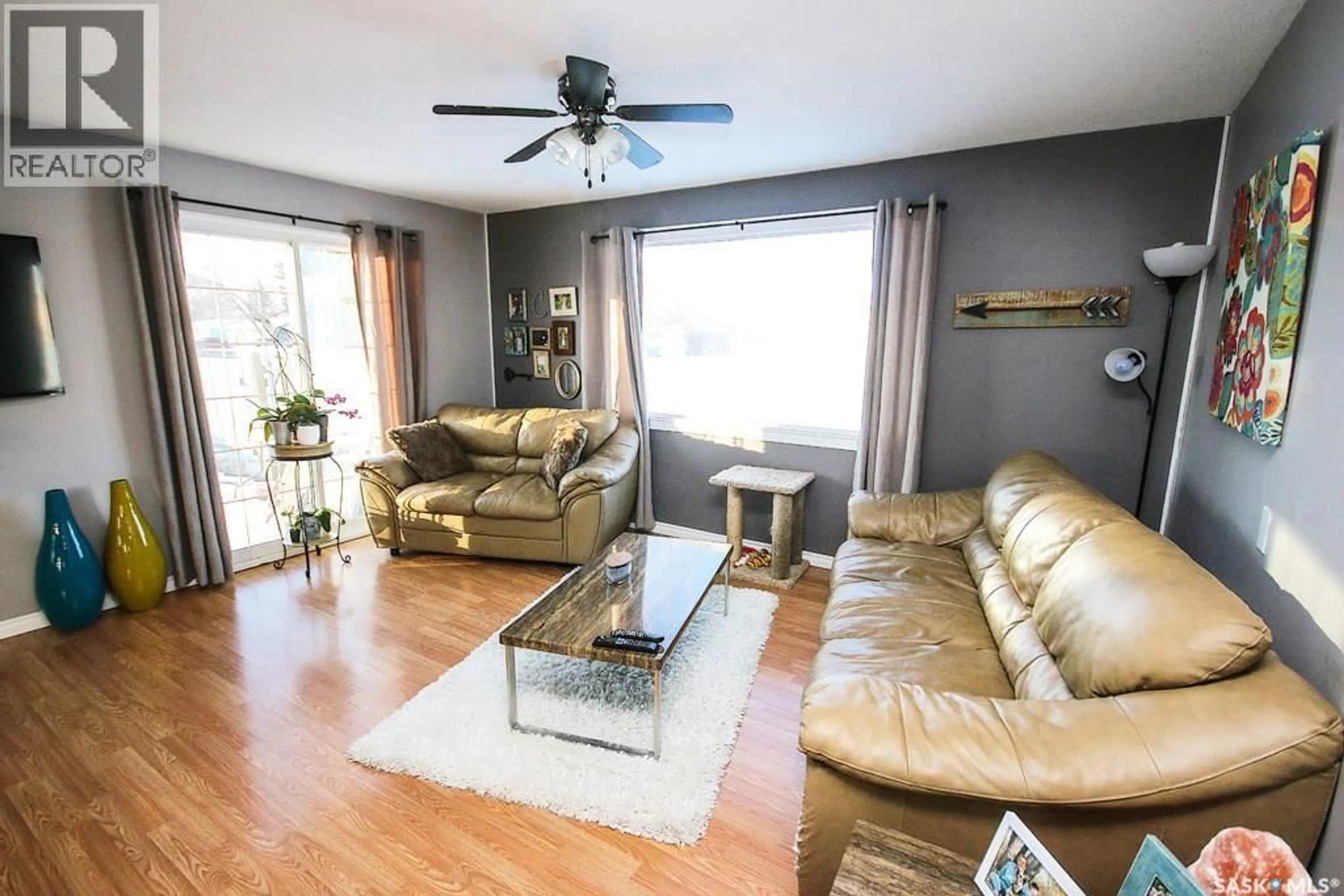 Living room with furniture, wood/laminate floor for 646 ALBERT STREET, Estevan Saskatchewan S4A1R6