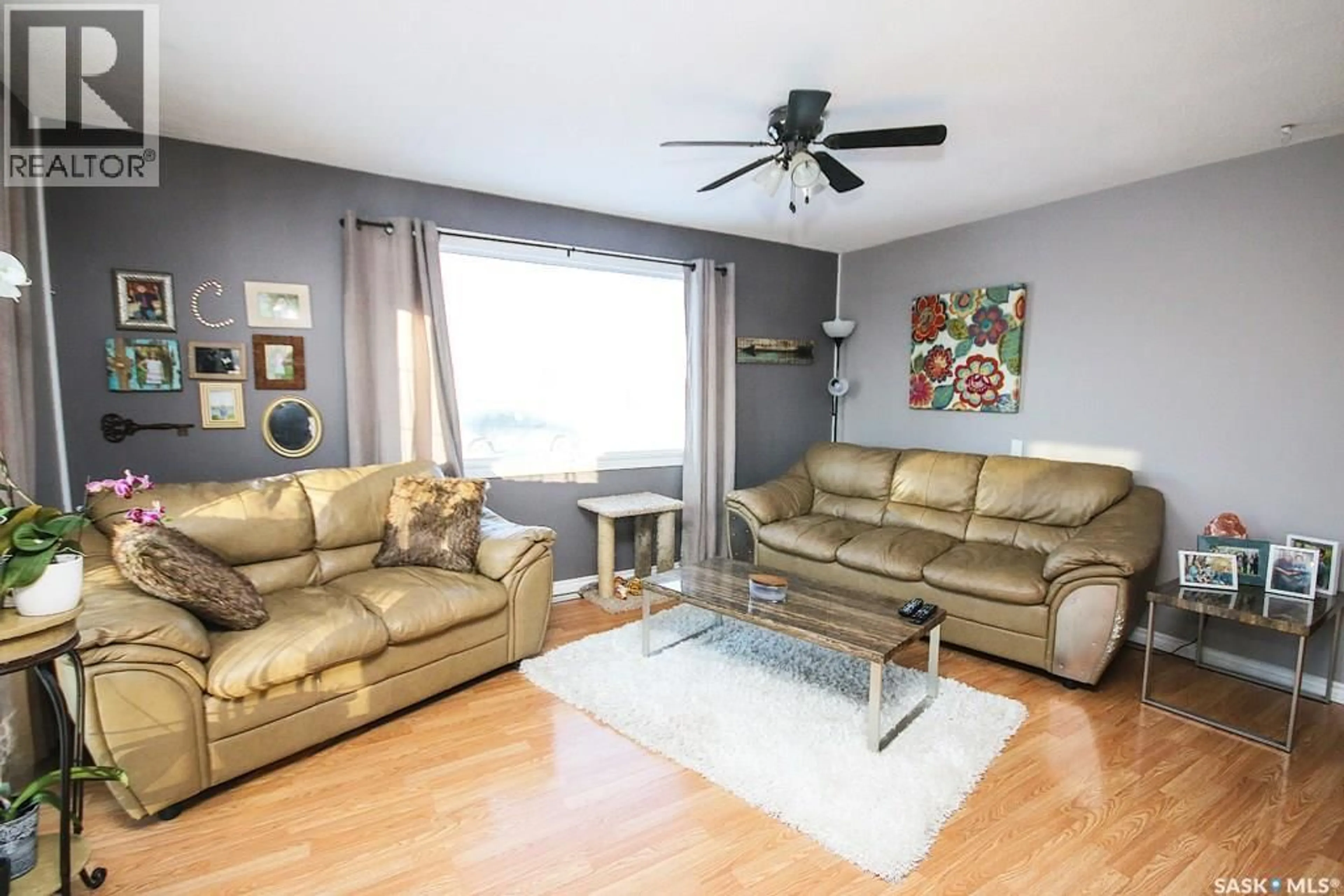 Living room with furniture, wood/laminate floor for 646 ALBERT STREET, Estevan Saskatchewan S4A1R6