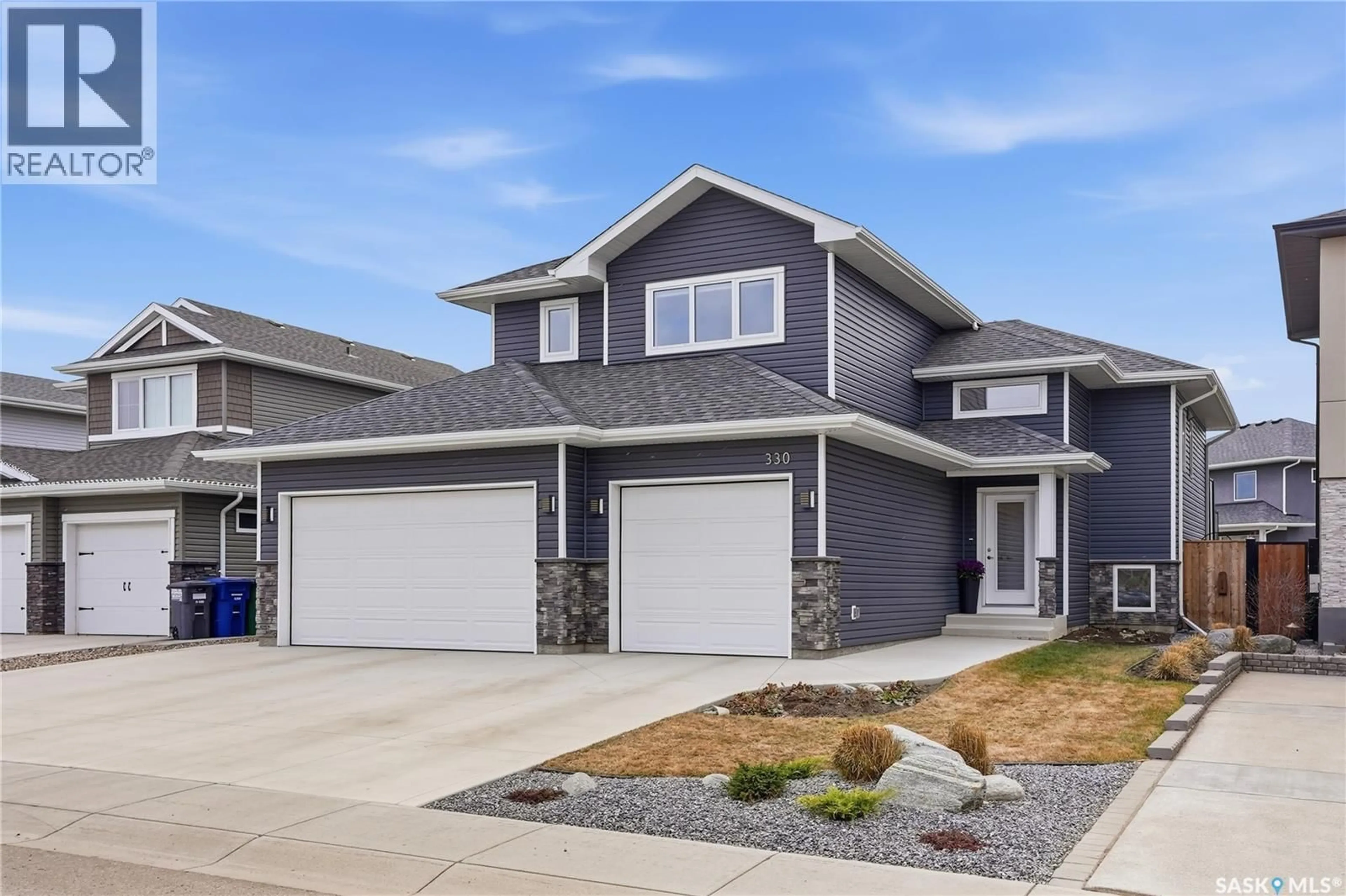 Home with vinyl exterior material, street for 330 HAMM WAY, Saskatoon Saskatchewan S7V0W3