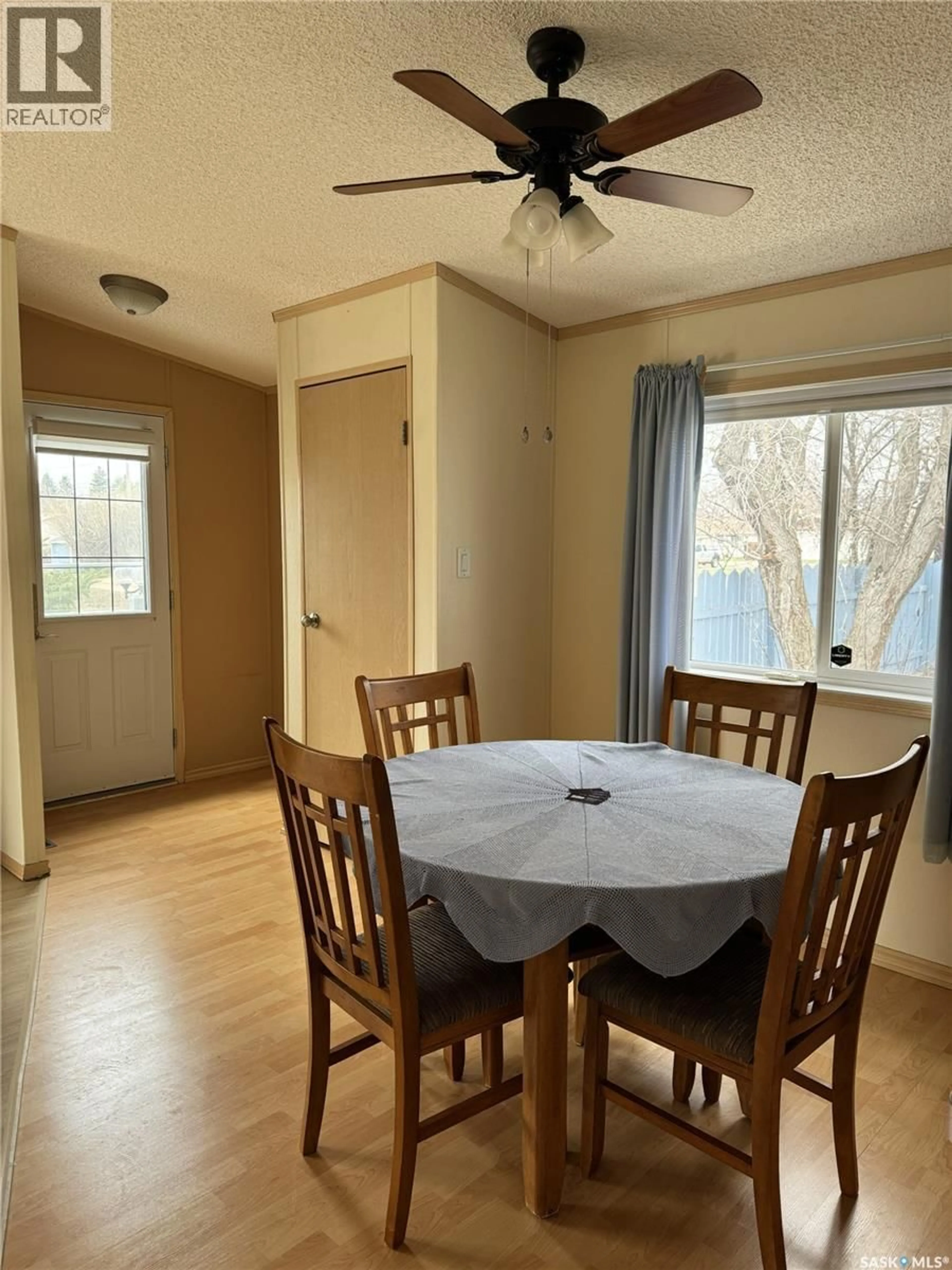 Dining room, wood/laminate floor for 803 RAILWAY AVENUE, Strasbourg Saskatchewan S0G4V0