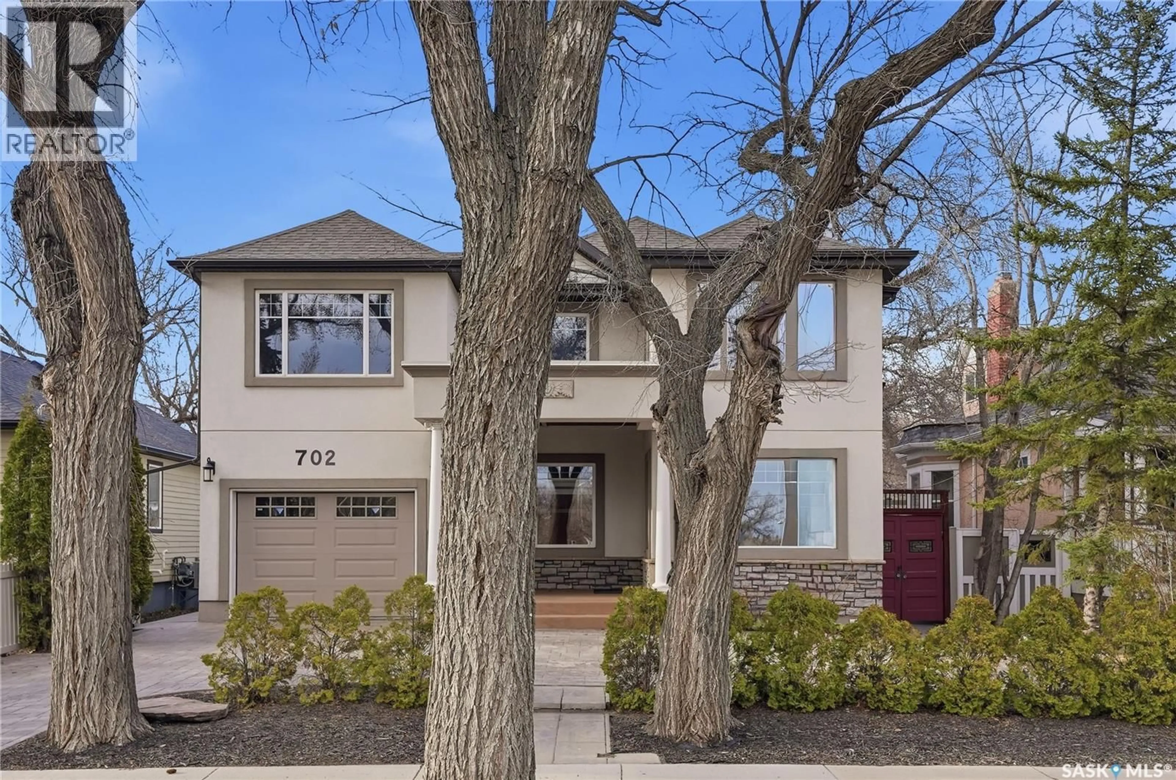 Home with brick exterior material, street for 702 QUEEN STREET, Saskatoon Saskatchewan S7K0M9