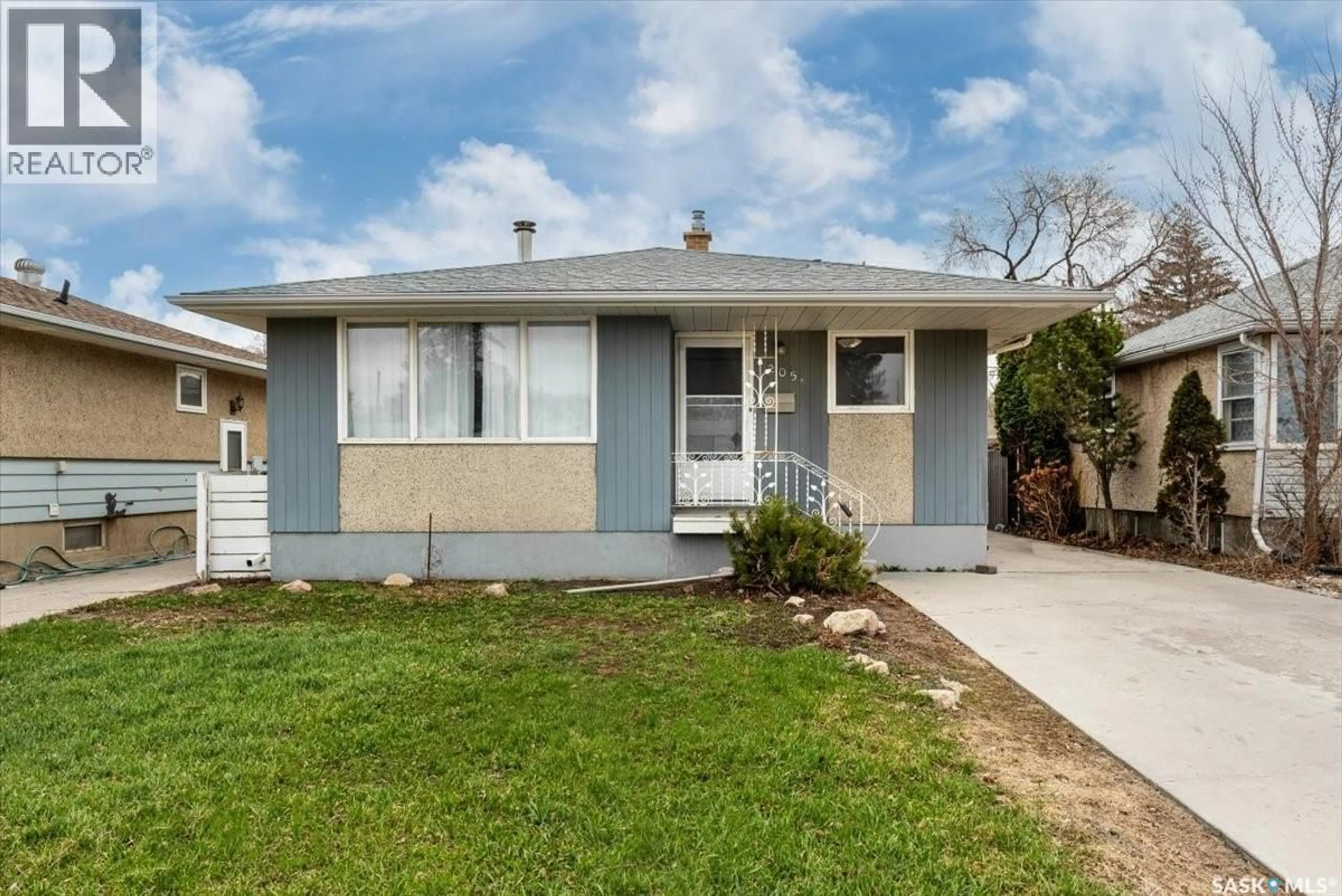 Home with vinyl exterior material, street for 205 BROAD STREET, Regina Saskatchewan S4R2X7