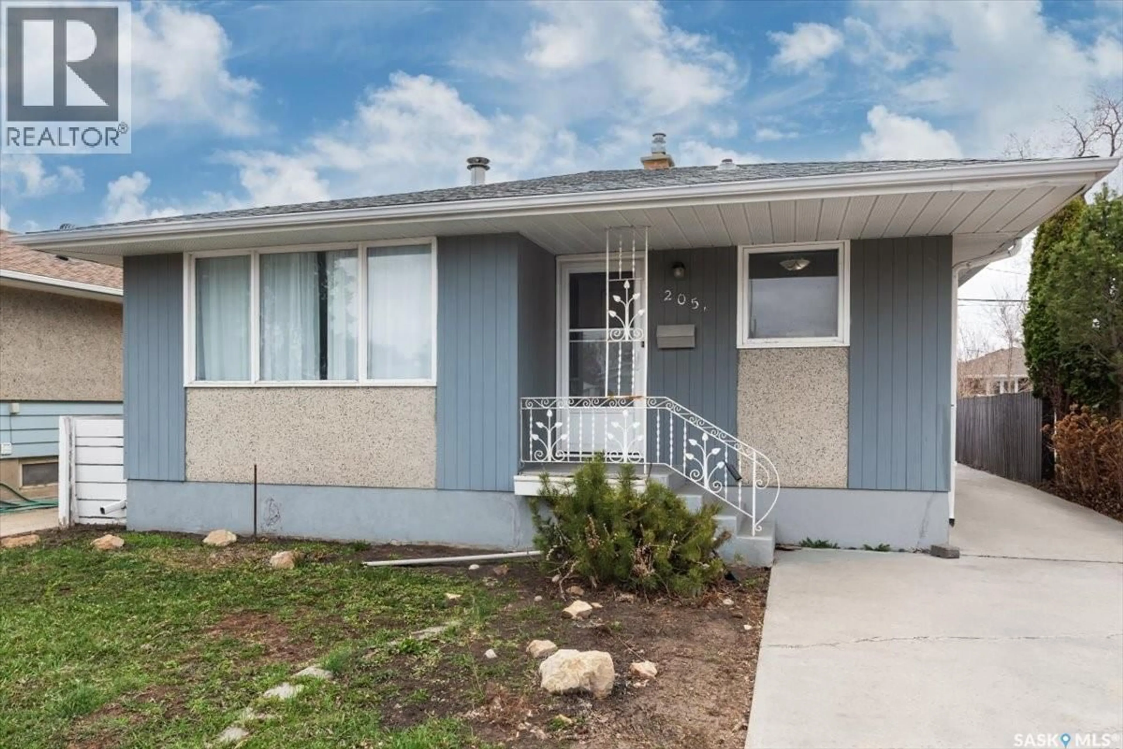Home with vinyl exterior material, street for 205 BROAD STREET, Regina Saskatchewan S4R2X7