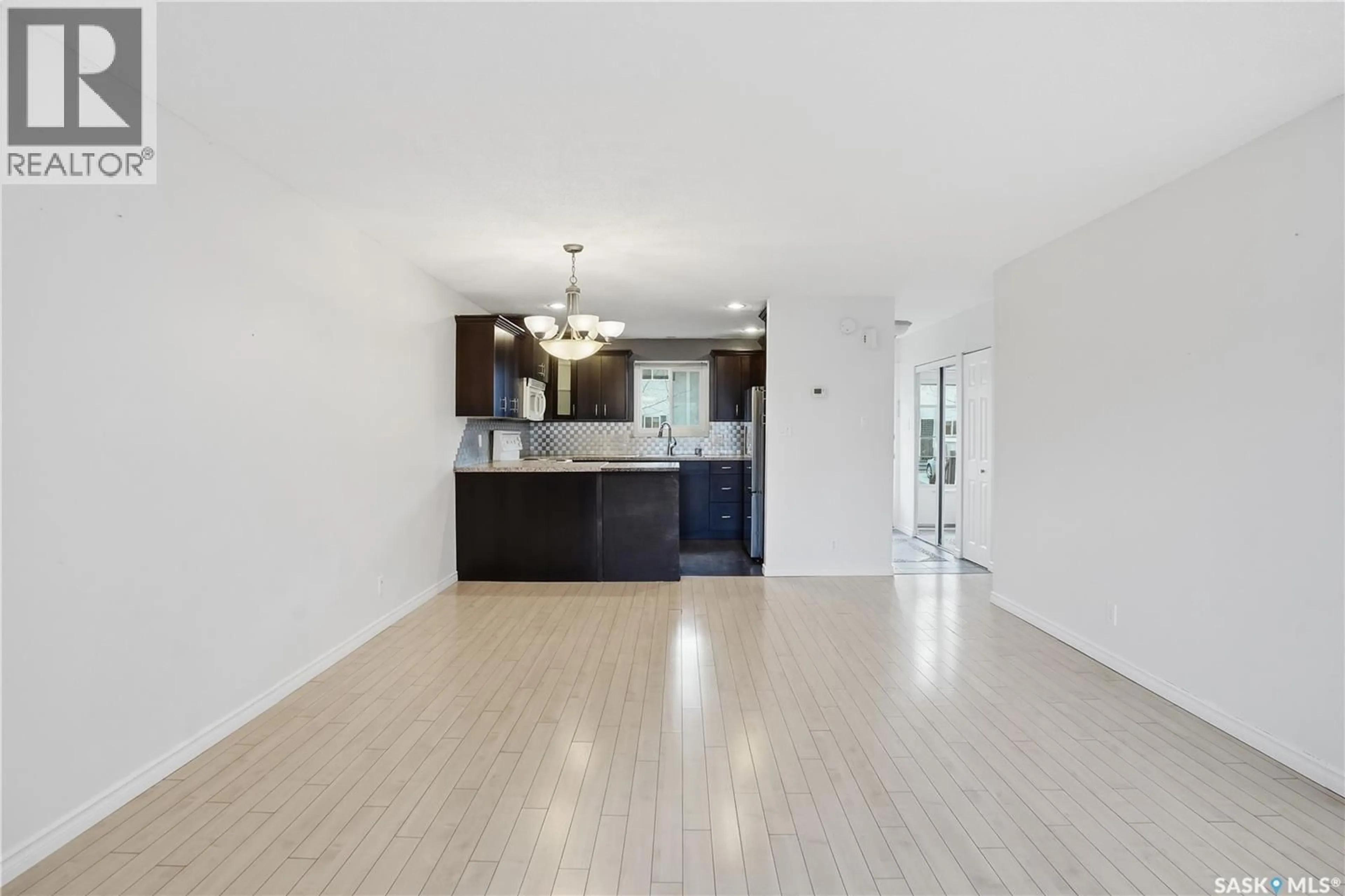 Open concept kitchen, wood/laminate floor for 15 KILLARNEY WAY, Regina Saskatchewan S4S6V8