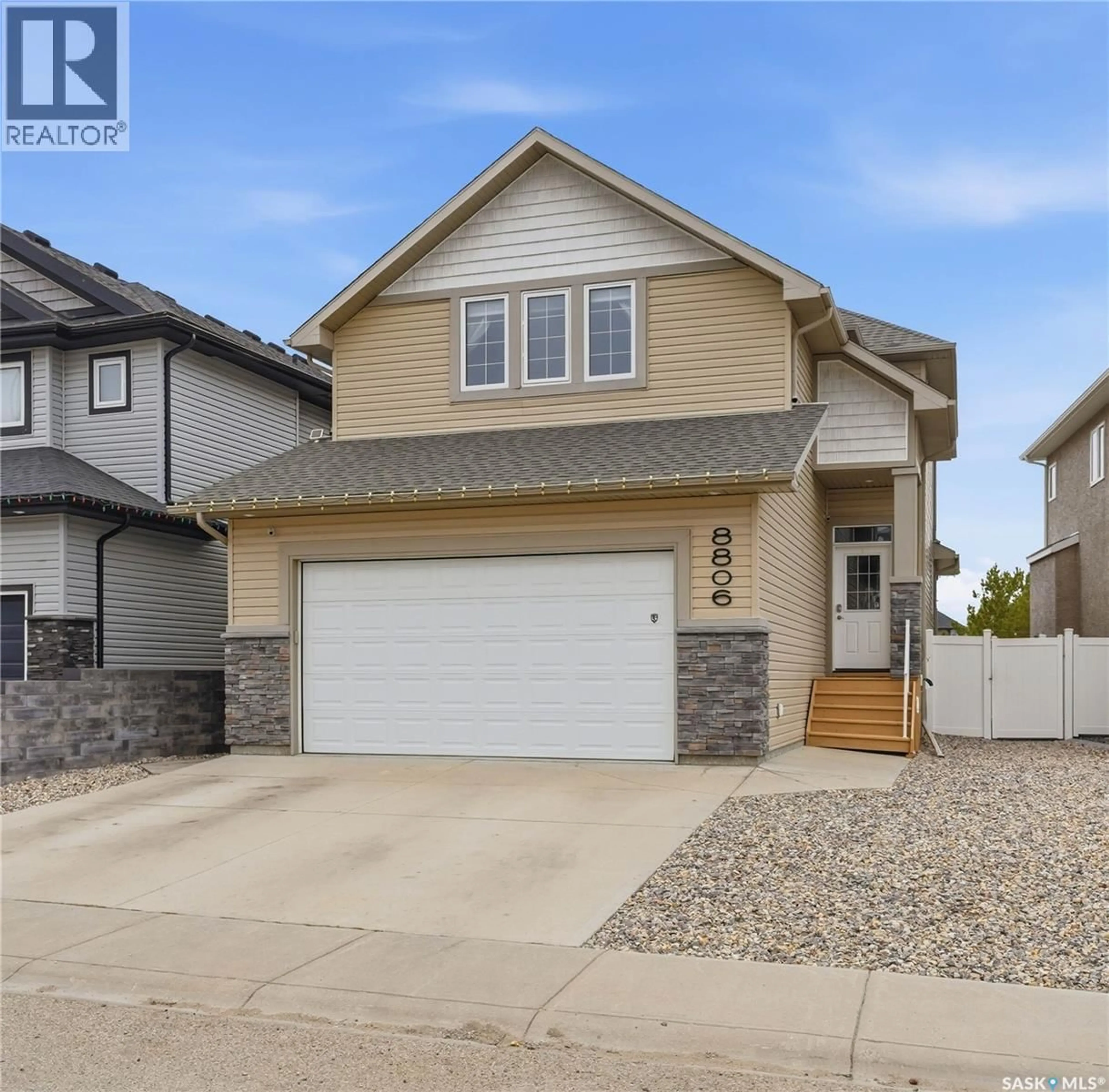 Home with vinyl exterior material, street for 8806 BAROOTES WAY, Regina Saskatchewan S4Y0C3