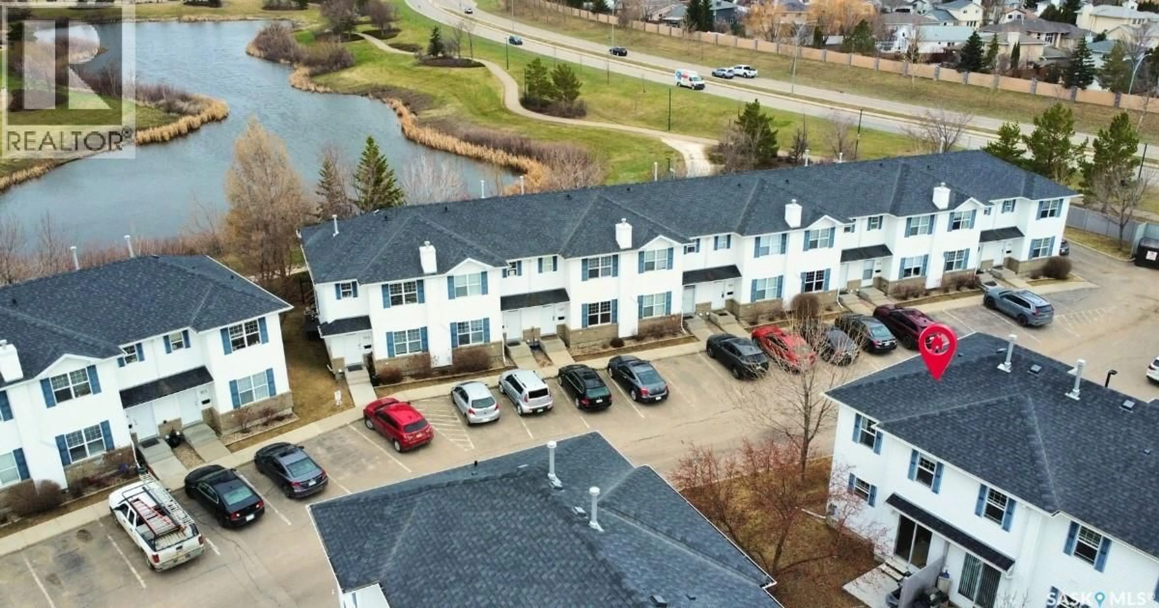 A pic from outside/outdoor area/front of a property/back of a property/a pic from drone, water/lake/river/ocean view for 127 203 HEROLD TERRACE, Saskatoon Saskatchewan S7V1H7