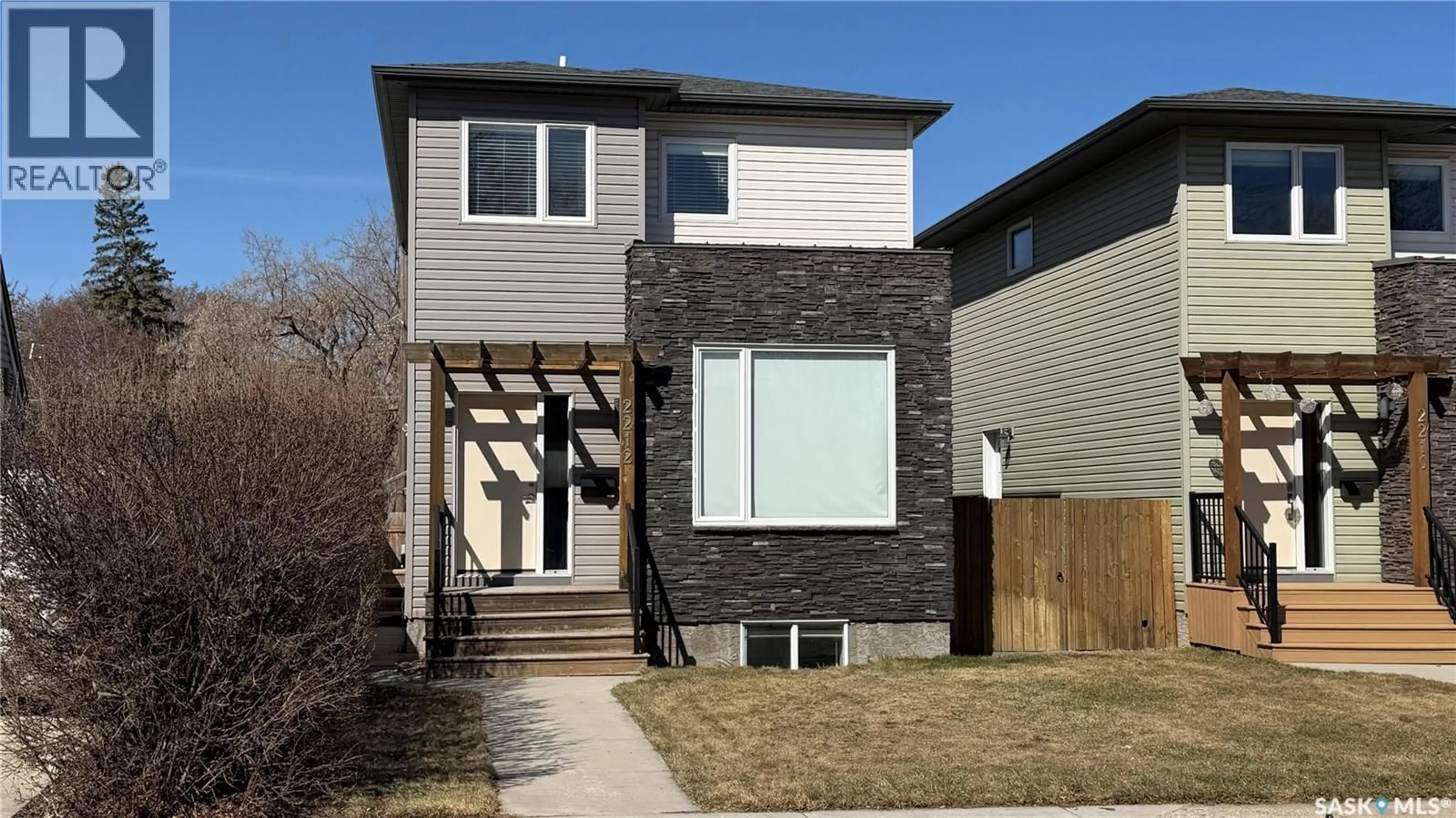 Home with brick exterior material, street for 2212 ST PATRICK AVENUE, Saskatoon Saskatchewan S7M0L3