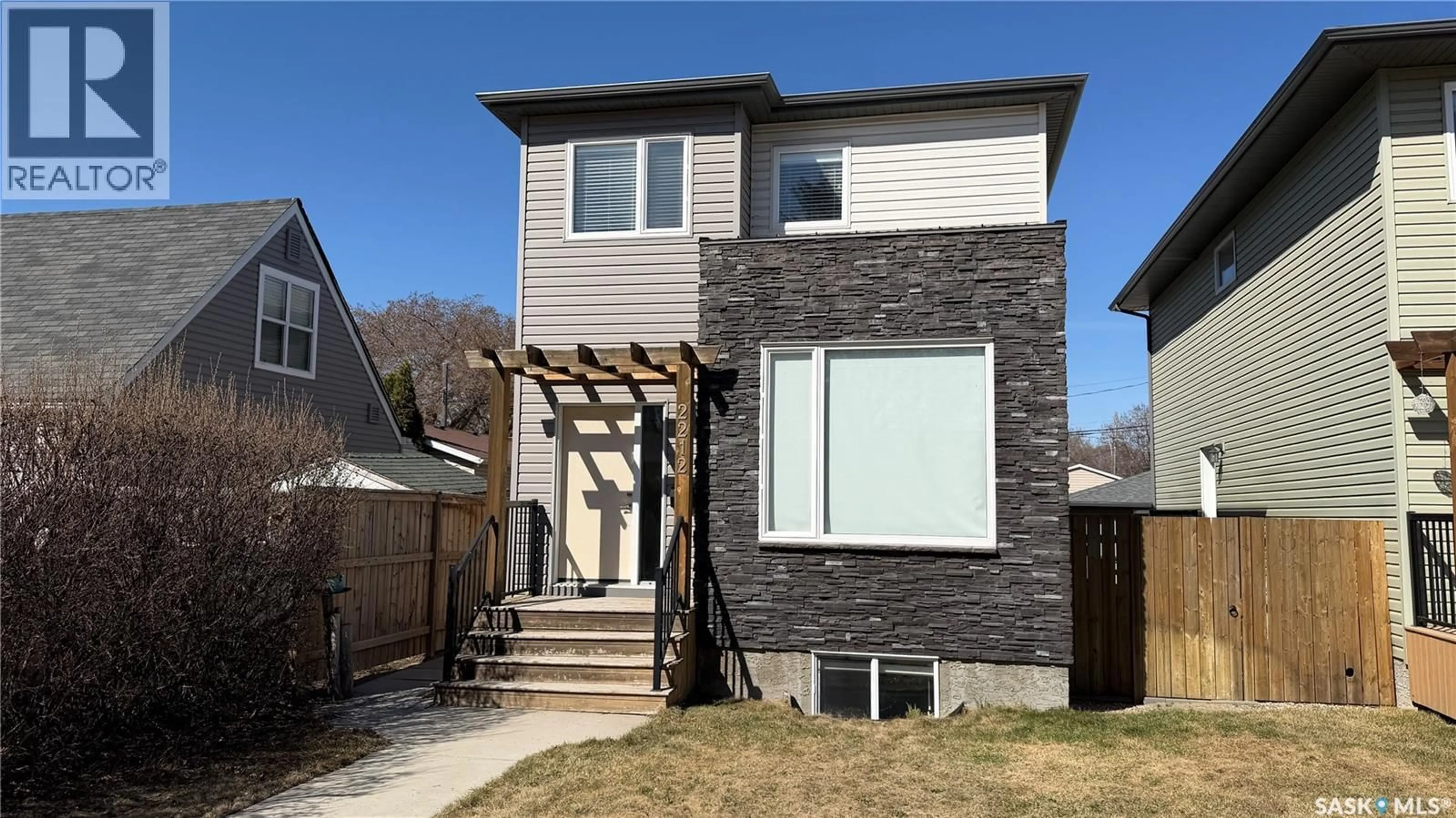 Home with brick exterior material, street for 2212 ST PATRICK AVENUE, Saskatoon Saskatchewan S7M0L3