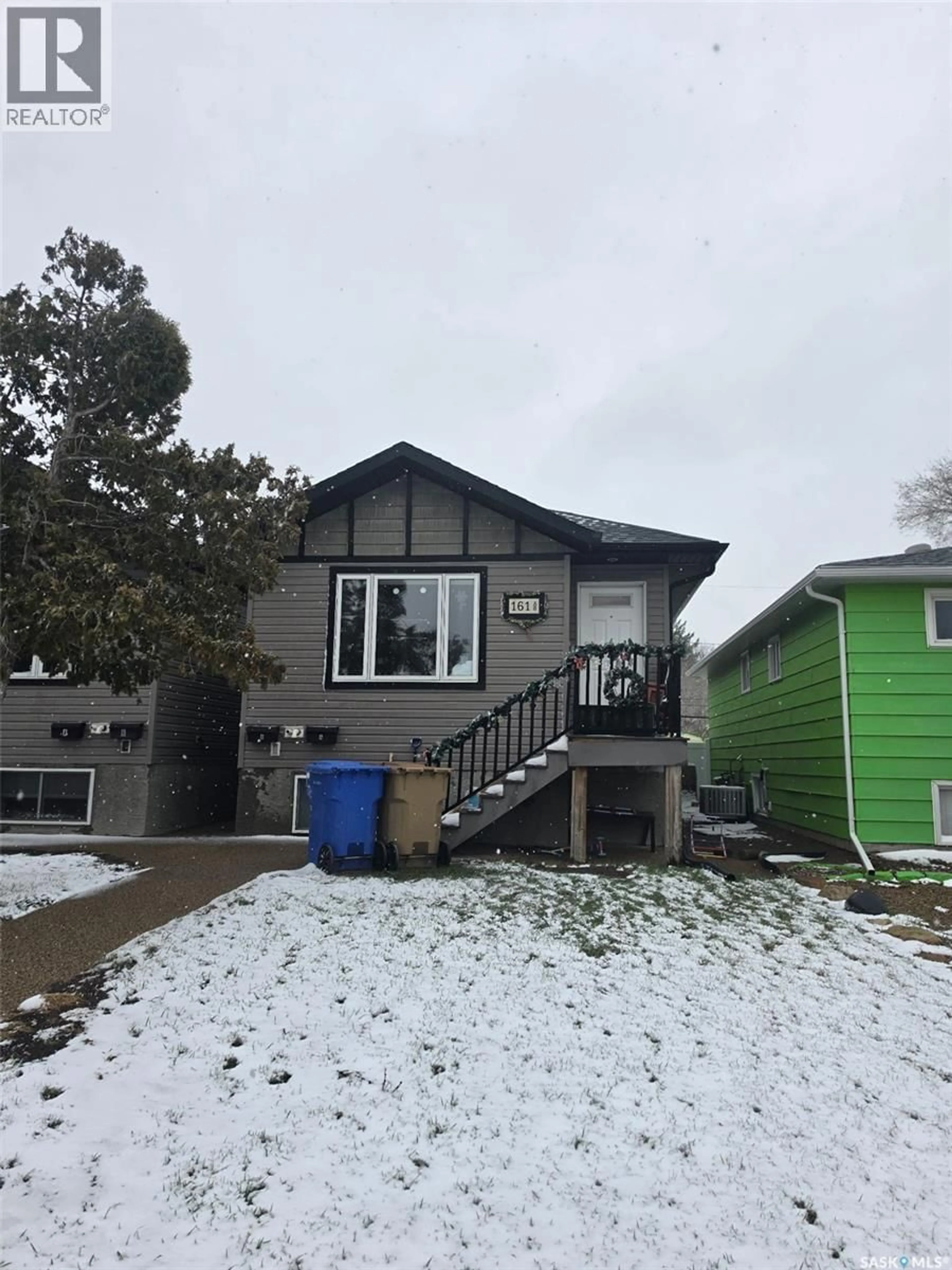 Home with vinyl exterior material, street for 161 MCINTYRE STREET, Regina Saskatchewan S4R3B6