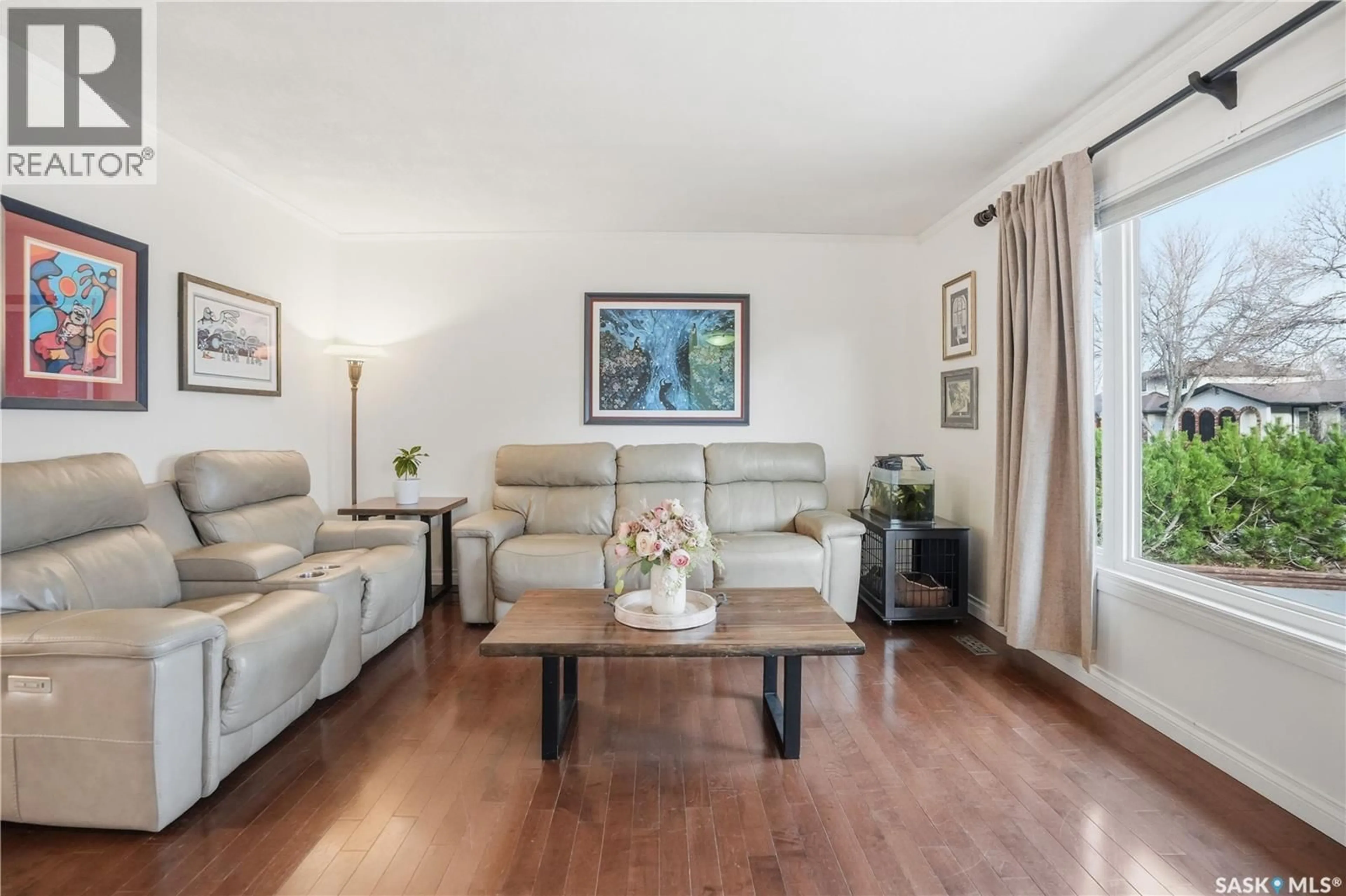 Living room with furniture, wood/laminate floor for 119 PAPPAS CRESCENT, Regina Saskatchewan S4R7G7
