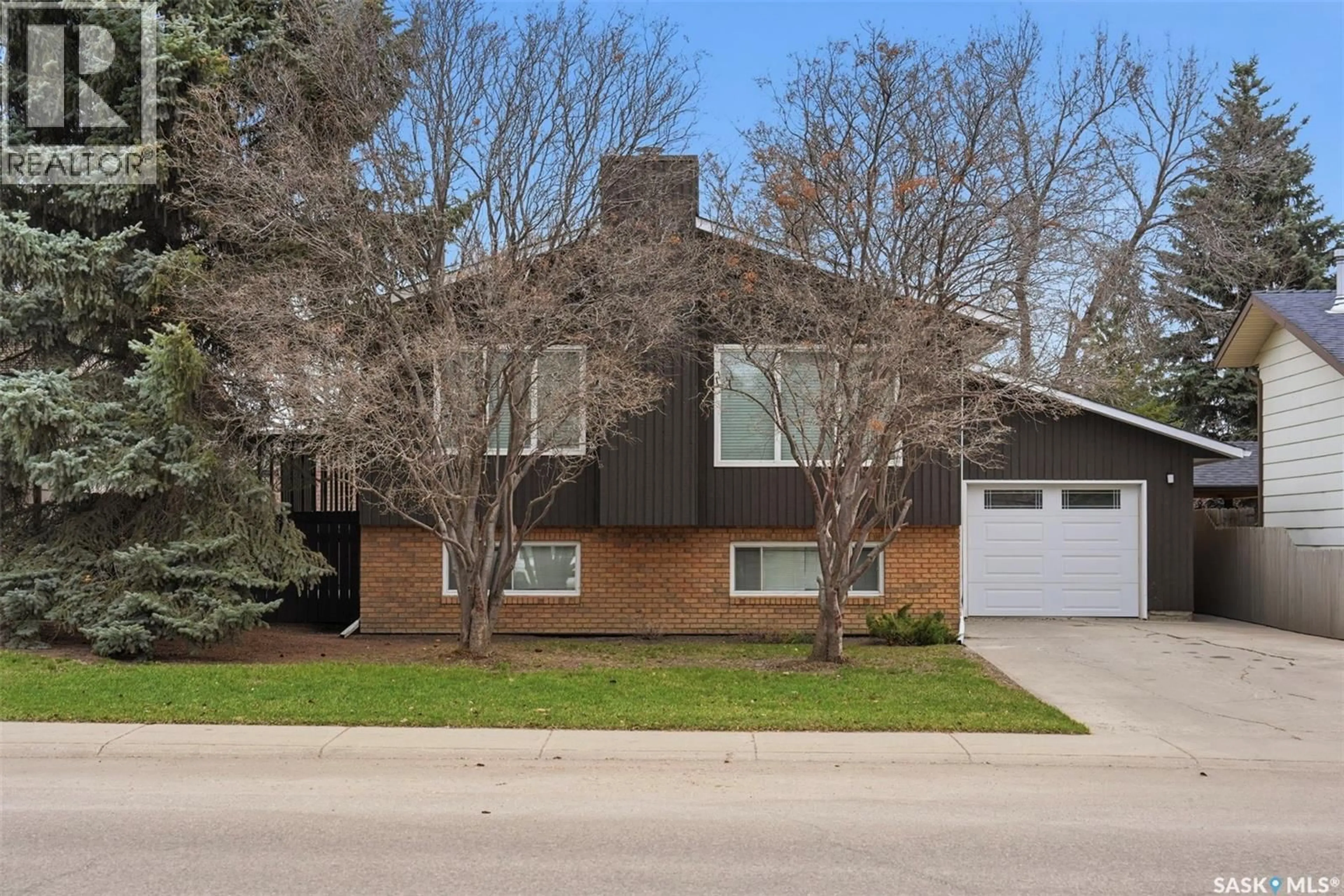Home with brick exterior material, street for 230 SILVERWOOD ROAD, Saskatoon Saskatchewan S7K5R9