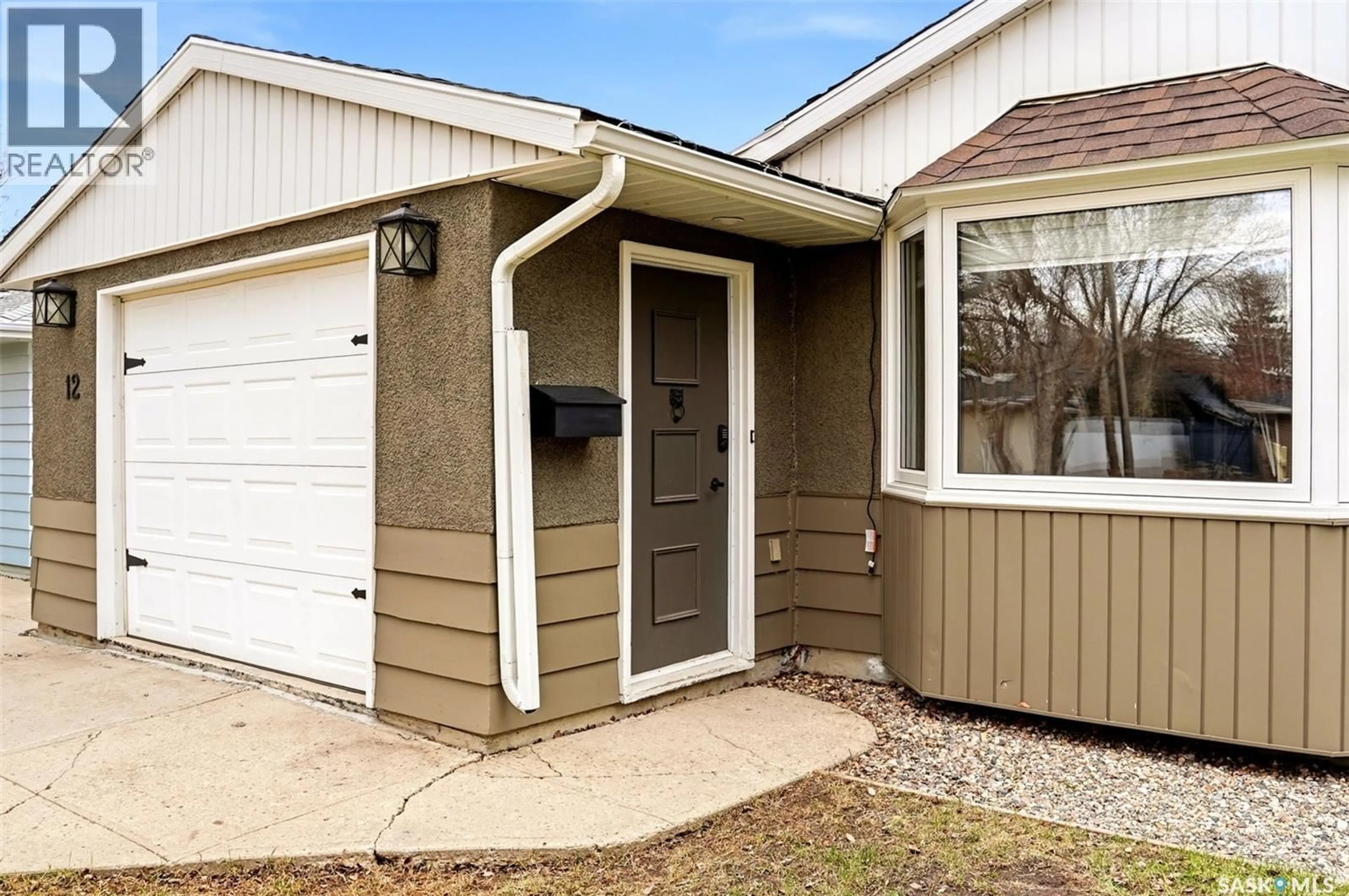 Home with vinyl exterior material, street for 12 FOX GLOVE CRESCENT, Regina Saskatchewan S4S0G9