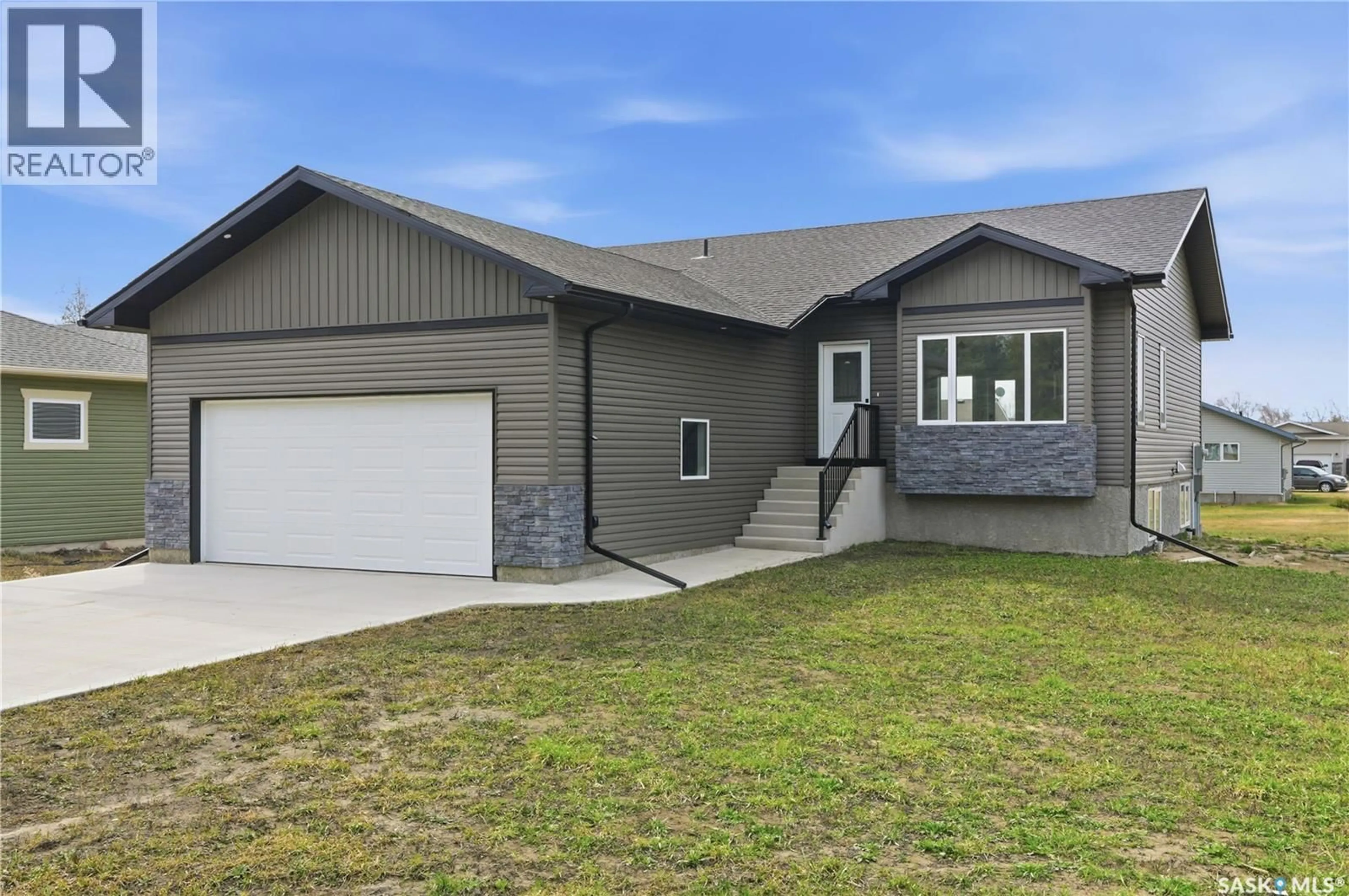 Home with vinyl exterior material, street for 208 2ND STREET, Waldheim Saskatchewan S0K4R0