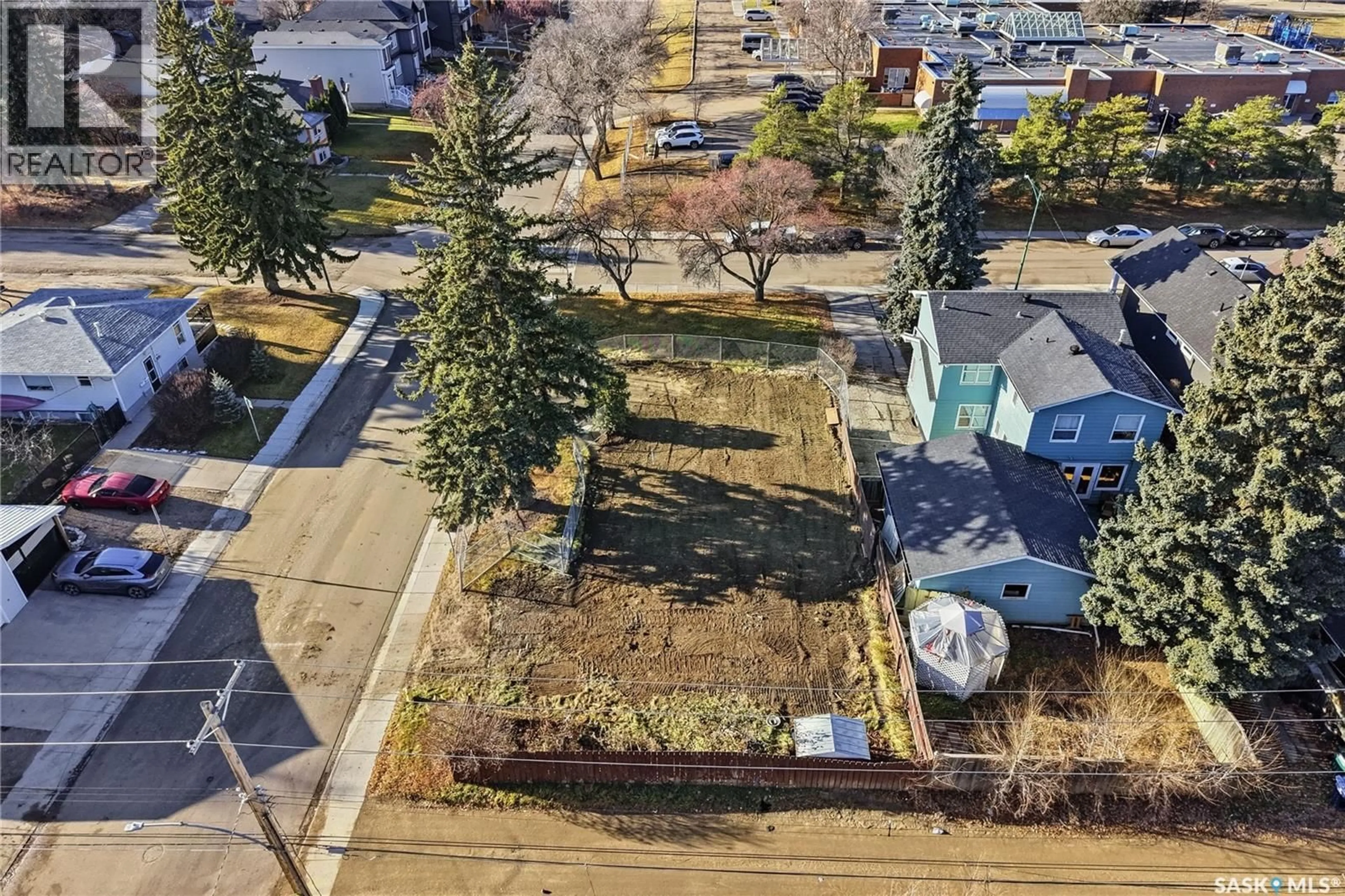 A pic from outside/outdoor area/front of a property/back of a property/a pic from drone, street for 1401 COLONY STREET, Saskatoon Saskatchewan S7N0S8